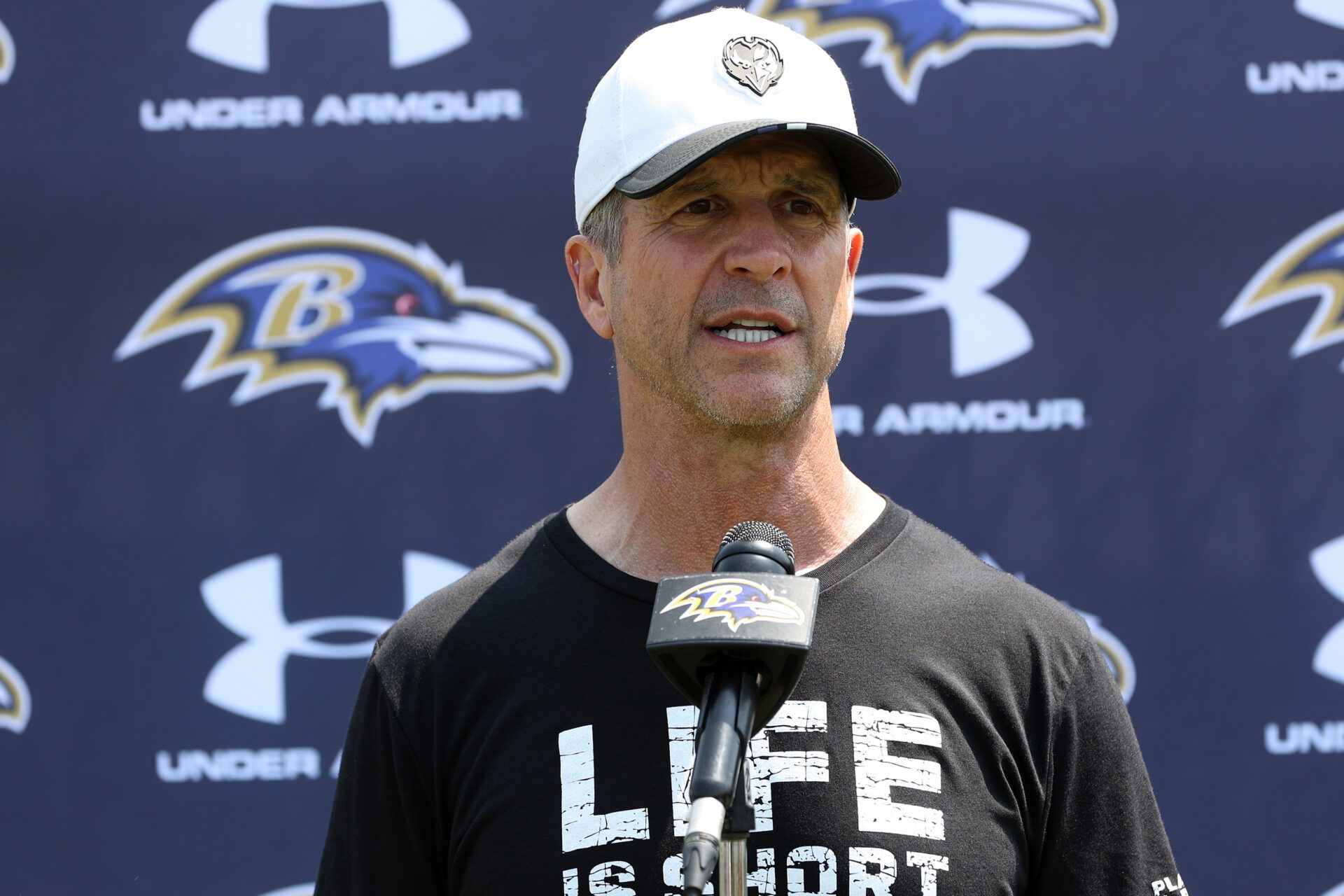 Baltimore Ravens head coach John Harbaugh speaks after an NFL OTA at Under Armour Performance Center.