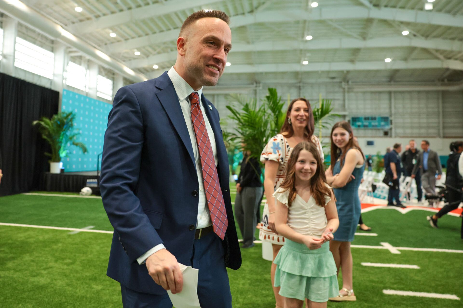 Miami Dolphins head coach Jeff Hafley meets with his wife and daughters after his introductory press conference at Baptist Health Training Complex.