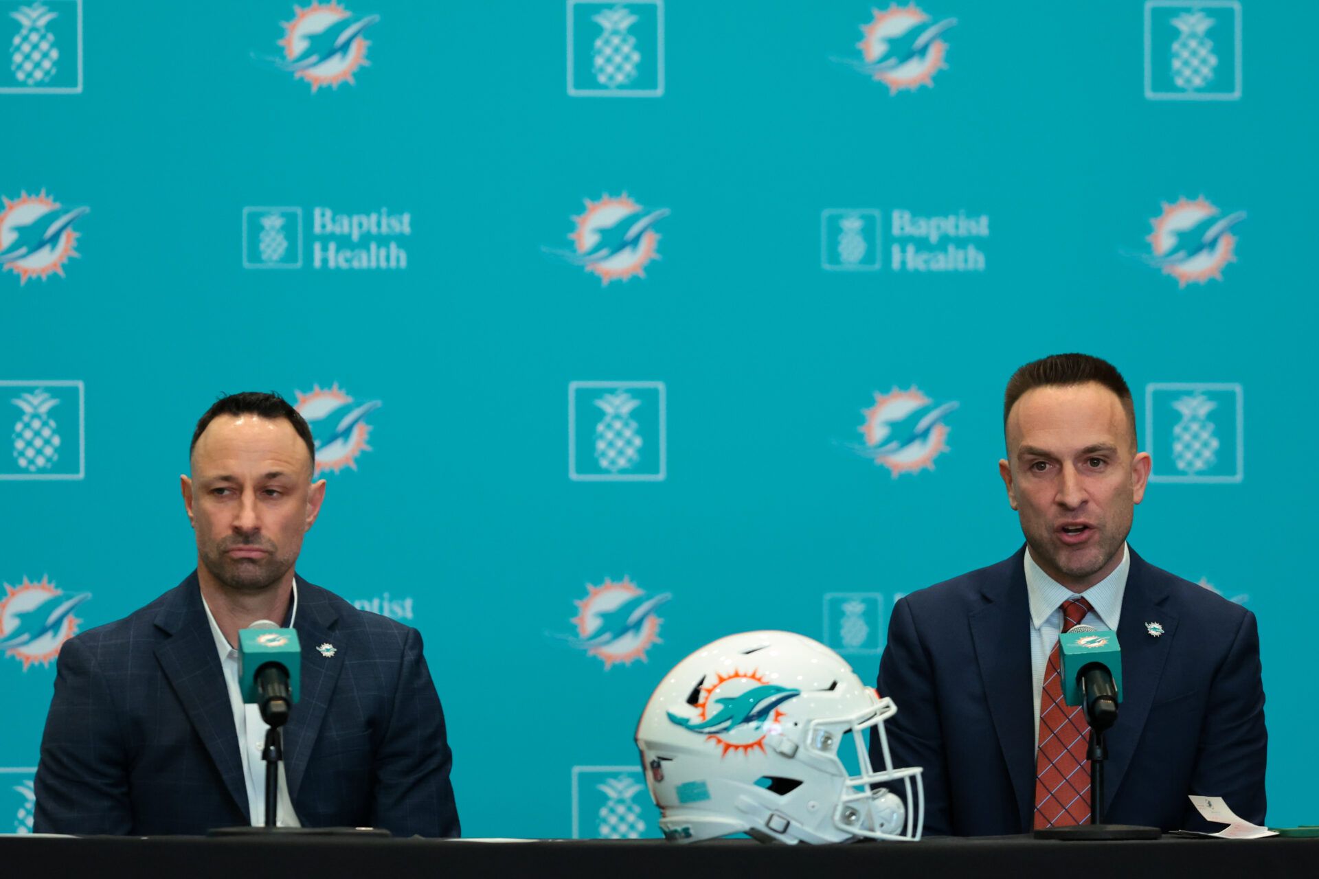 Miami Dolphins head coach Jeff Hafley, right, joined by general manager Jon-Eric Sullivan, left, speak to reporters during their introductory press conference at Baptist Health Training Complex.