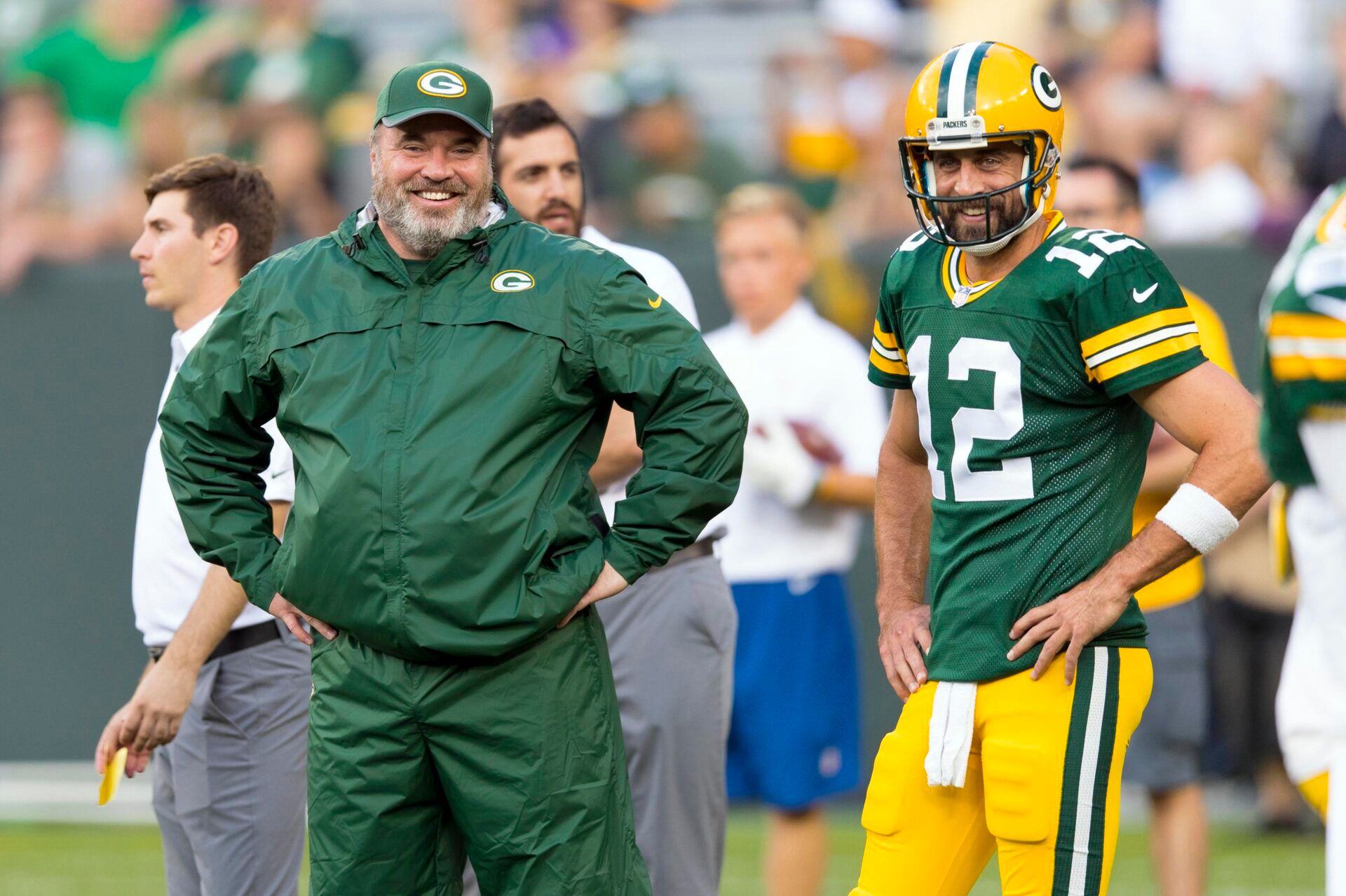 Green Bay Packers head coach Mike McCarthy talks with quarterback Aaron Rodgers (12) during warmups prior to the game against the Philadelphia Eagles at Lambeau Field.