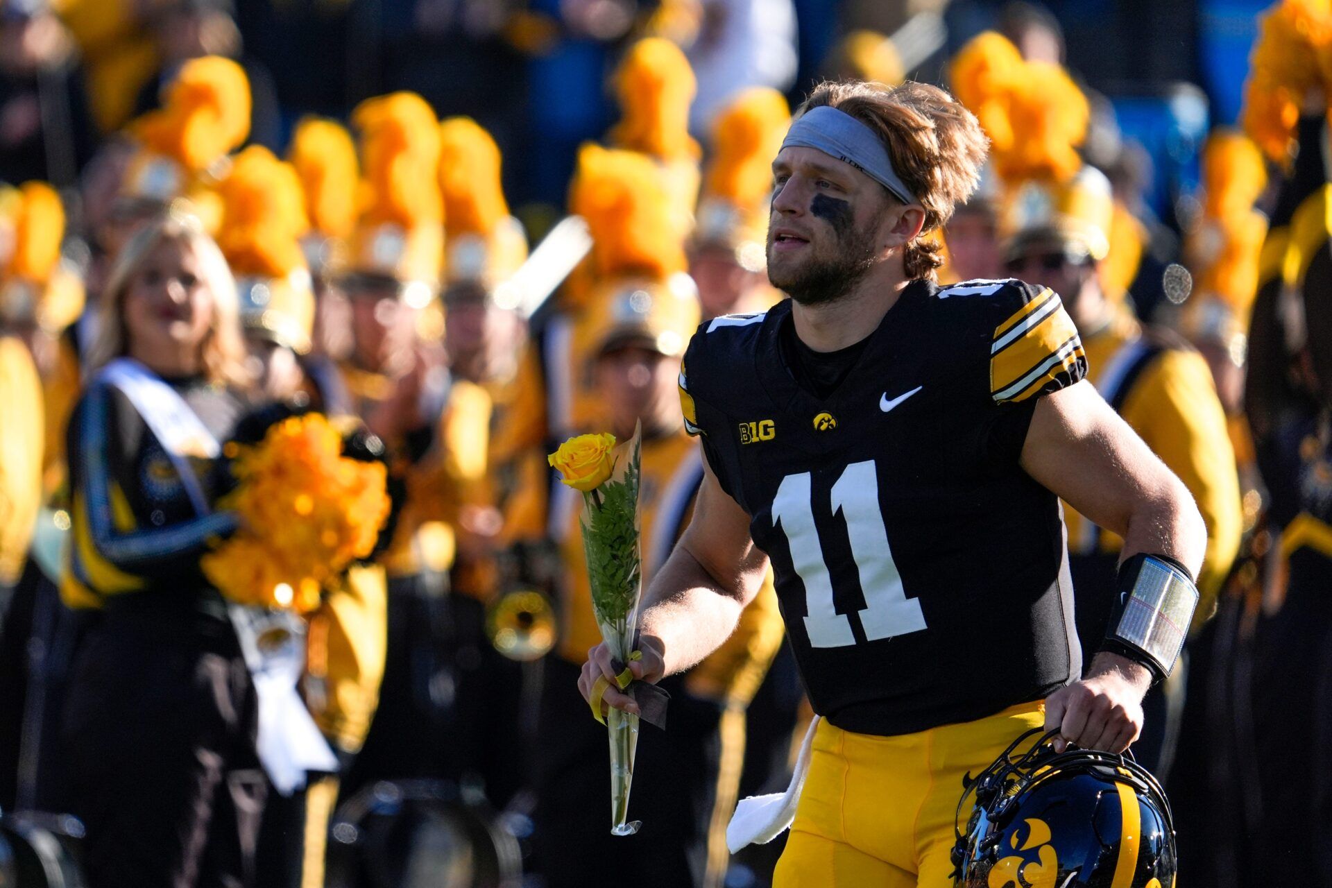 Iowa Hawkeyes quarterback Mark Gronowski (11) runs onto the field during senior recognition Nov. 22, 2025 at Kinnick Stadium in Iowa City, Iowa.