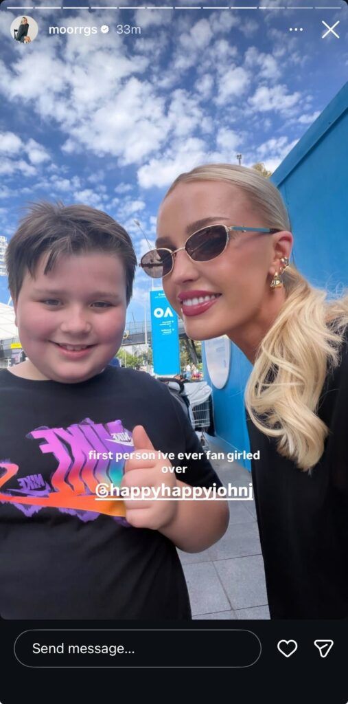 Morgan Riddle with young fan John at Melbourne Park