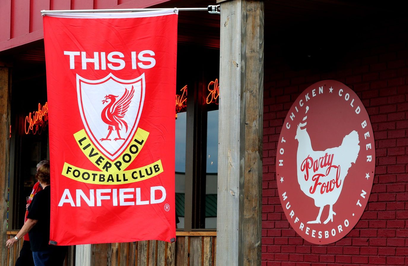 A Liverpool Football Club flag hangs outside of the Murfreesboro Party Fowl as members of The Middle Tennessee Liverpool Football Club gathers to watch a game against Norwich on Friday Aug. 9, 2019.

20 Liverpool Football