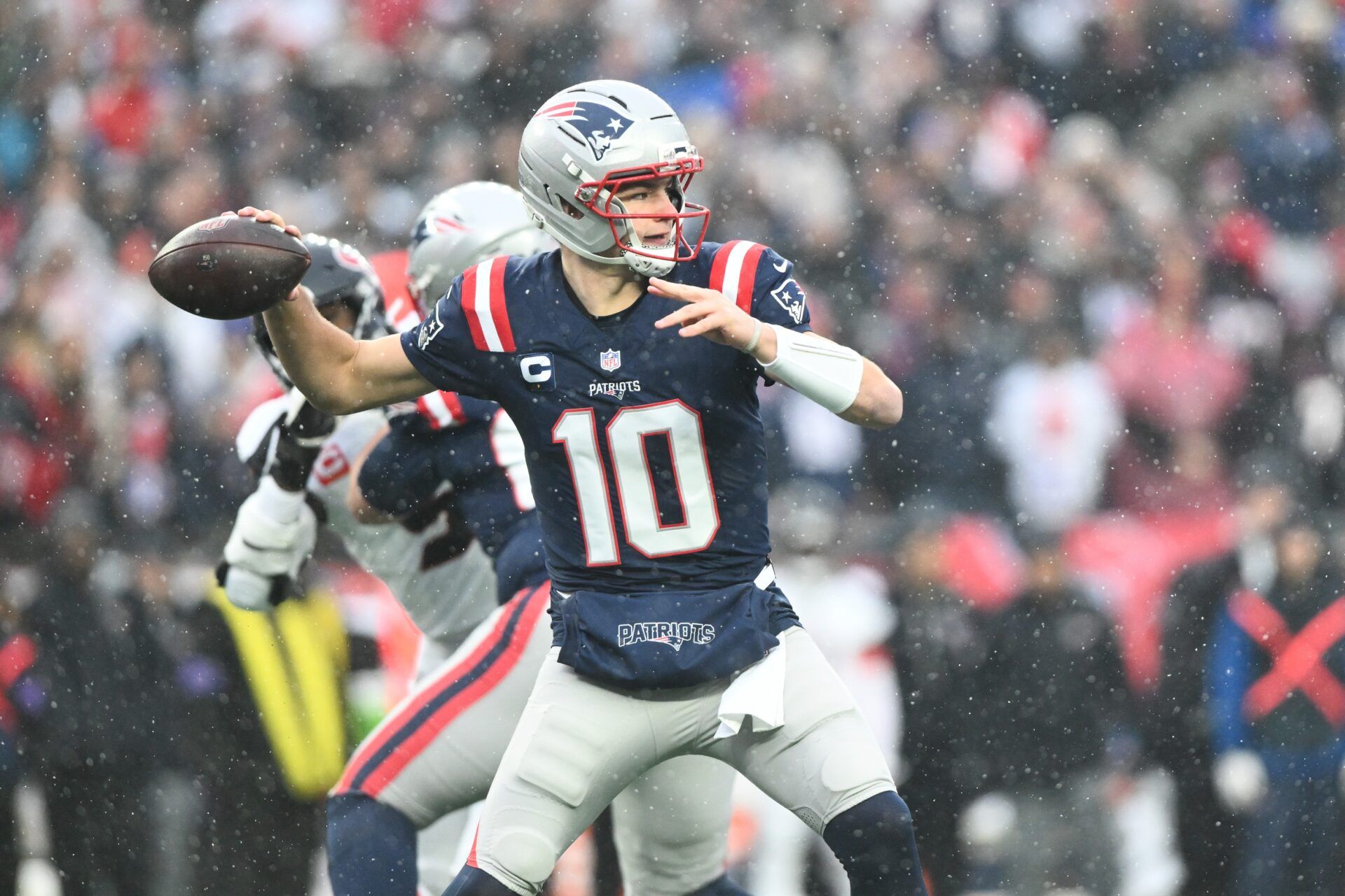 New England Patriots quarterback Drake Maye (10) throws in the first quarter in an AFC Divisional Round game against the Houston Texans at Gillette Stadium.