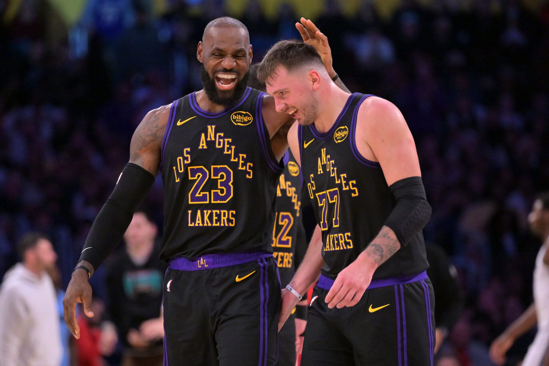 Los Angeles Lakers forward LeBron James (23) and Los Angeles Lakers guard Luka Doncic (77) walk to the bench during a time out in the second half at Crypto.com Arena.