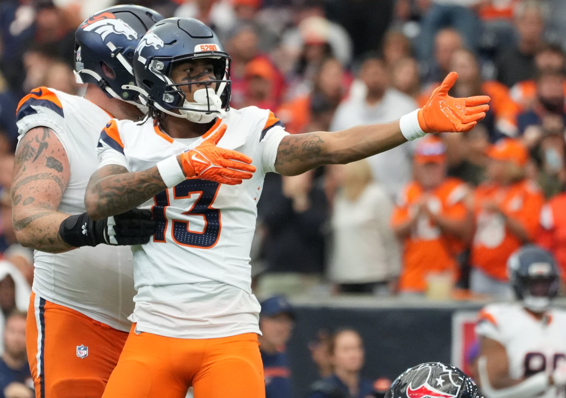 Denver Broncos wide receiver Pat Bryant (13) celebrates after a first down during the second half against the Houston Texans at NRG Stadium.