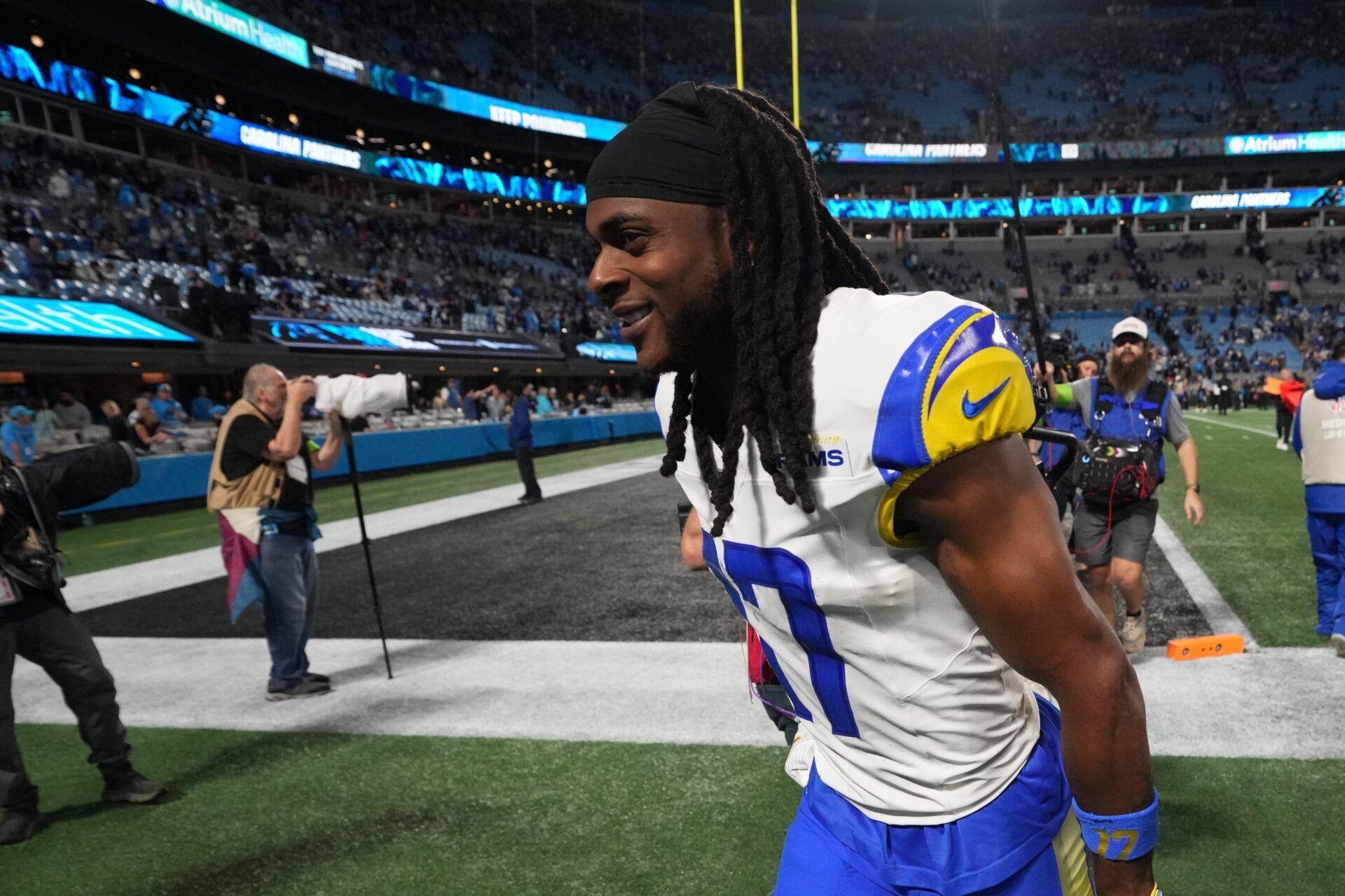 Los Angeles Rams wide receiver Davante Adams (17) runs off the field after the NFC Wild Card Round game at Bank of America Stadium.