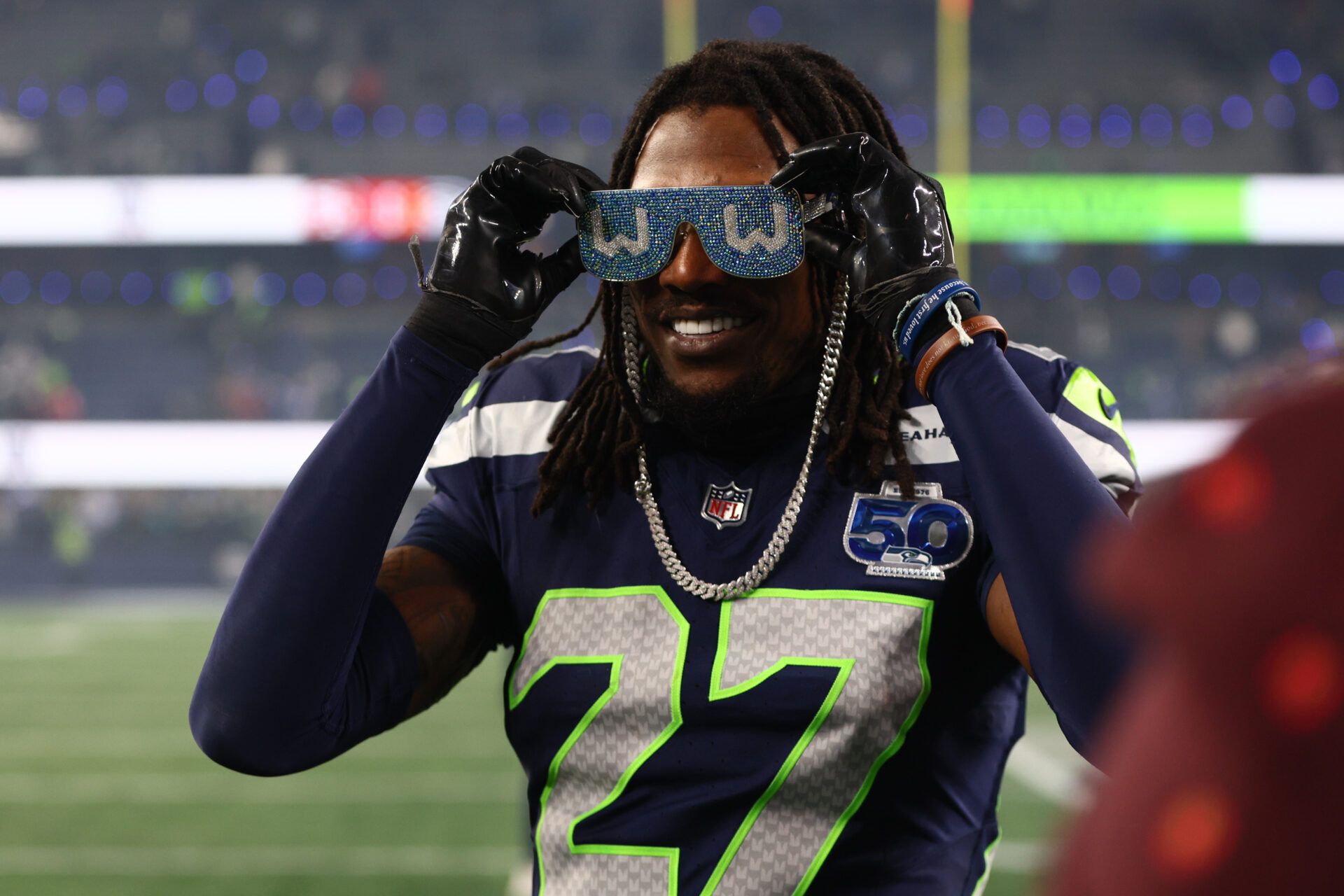 Seattle Seahawks cornerback Riq Woolen (27) celebrates following an NFC Divisional Round game against the San Francisco 49ers at Lumen Field.