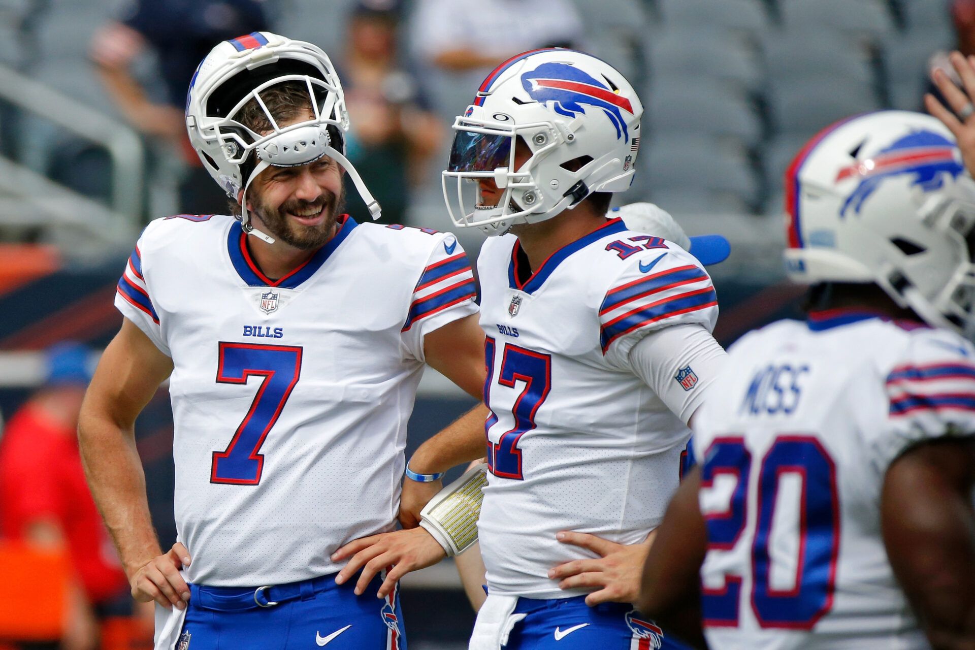Buffalo Bills quarterback Davis Webb (left) talks with quarterback Josh Allen (17) during warmups before the game against the Chicago Bears at Soldier Field.