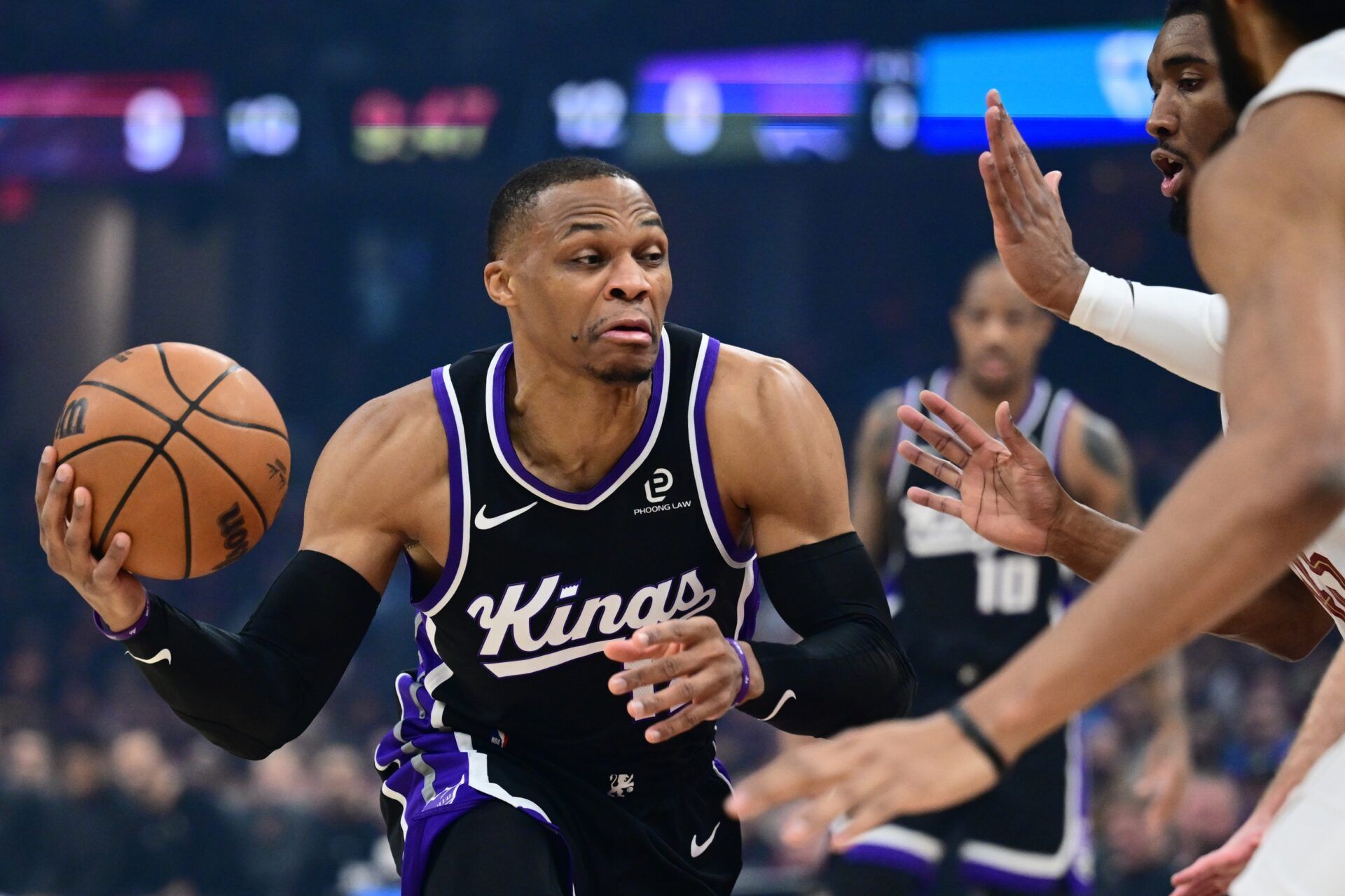 Sacramento Kings guard Russell Westbrook (18) drives to the basket against Cleveland Cavaliers guard Donovan Mitchell (45) during the first quarter at Rocket Arena.