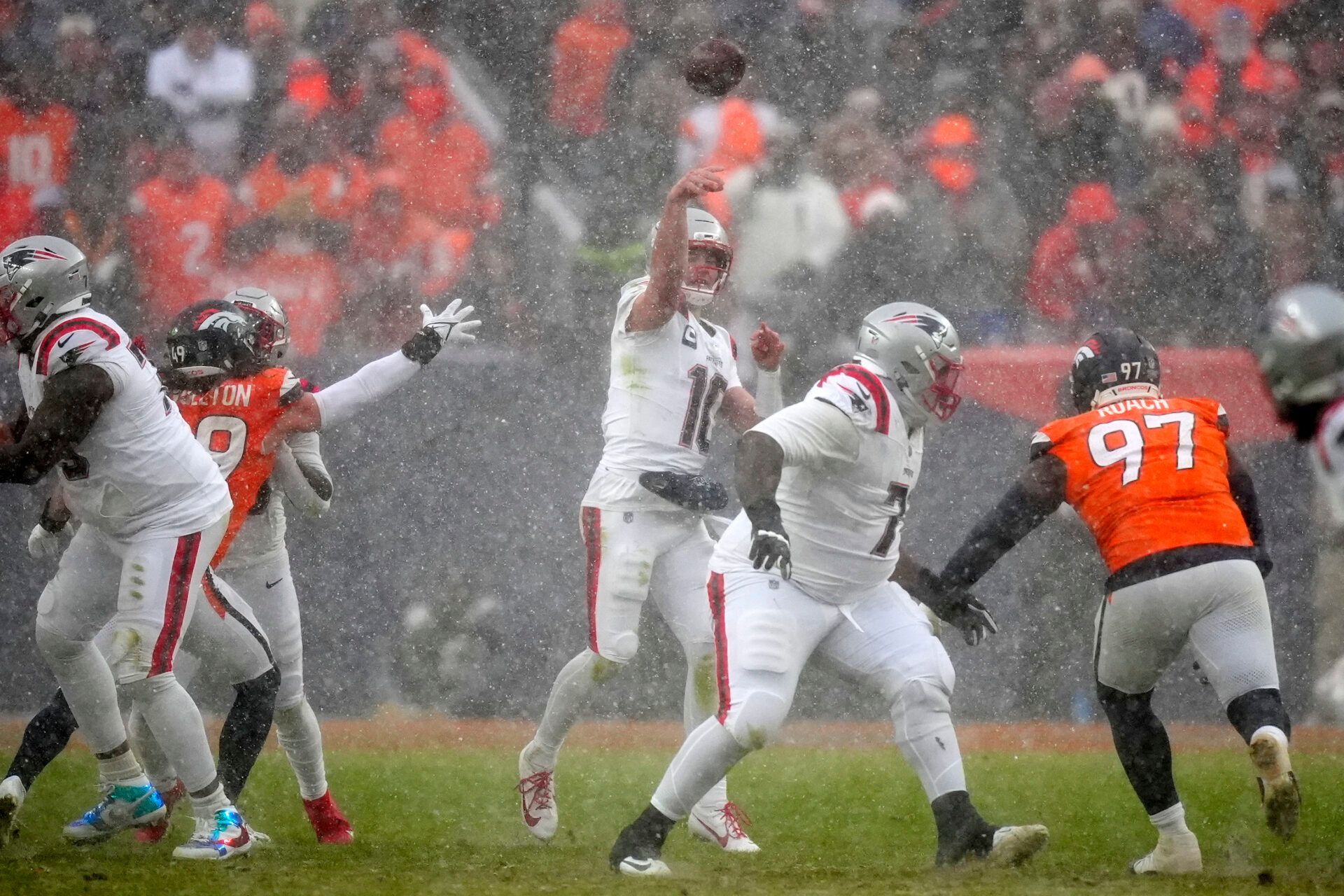 New England Patriots quarterback Drake Maye (10) drops back to pass against the Denver Broncos during the second half in the 2026 AFC Championship Game at Empower Field at Mile High.