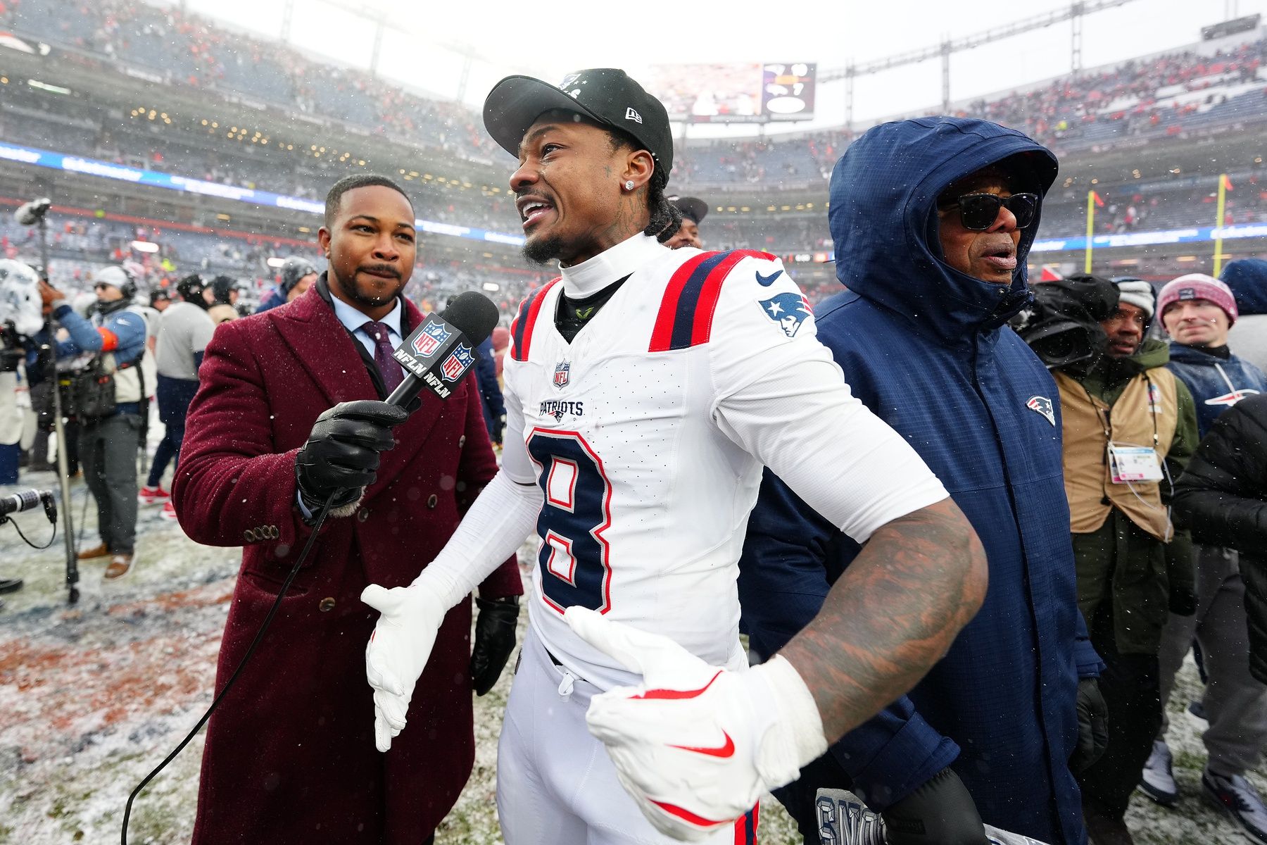 New England Patriots wide receiver Stefon Diggs (8) speaks to the media after defeating the Denver Broncos in the 2026 AFC Championship Game at Empower Field at Mile High.