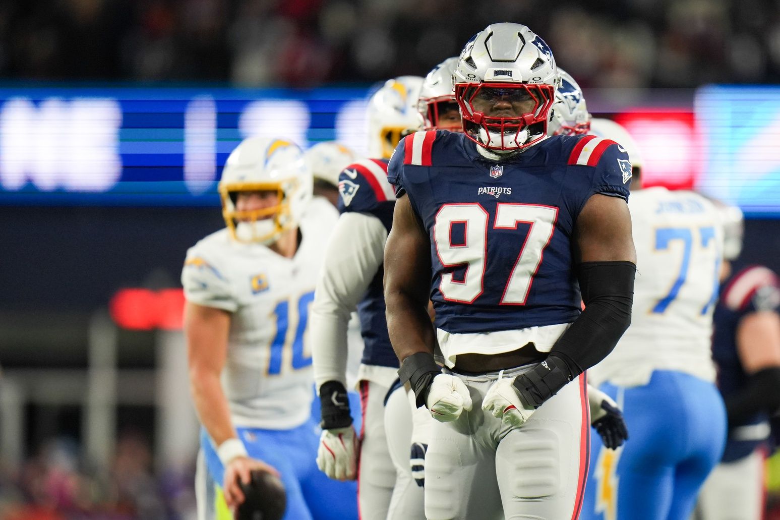New England Patriots defensive end Milton Williams (97) celebrates a sack during the second quarter against the Los Angeles Chargers in an AFC Wild Card Round game at Gillette Stadium.
