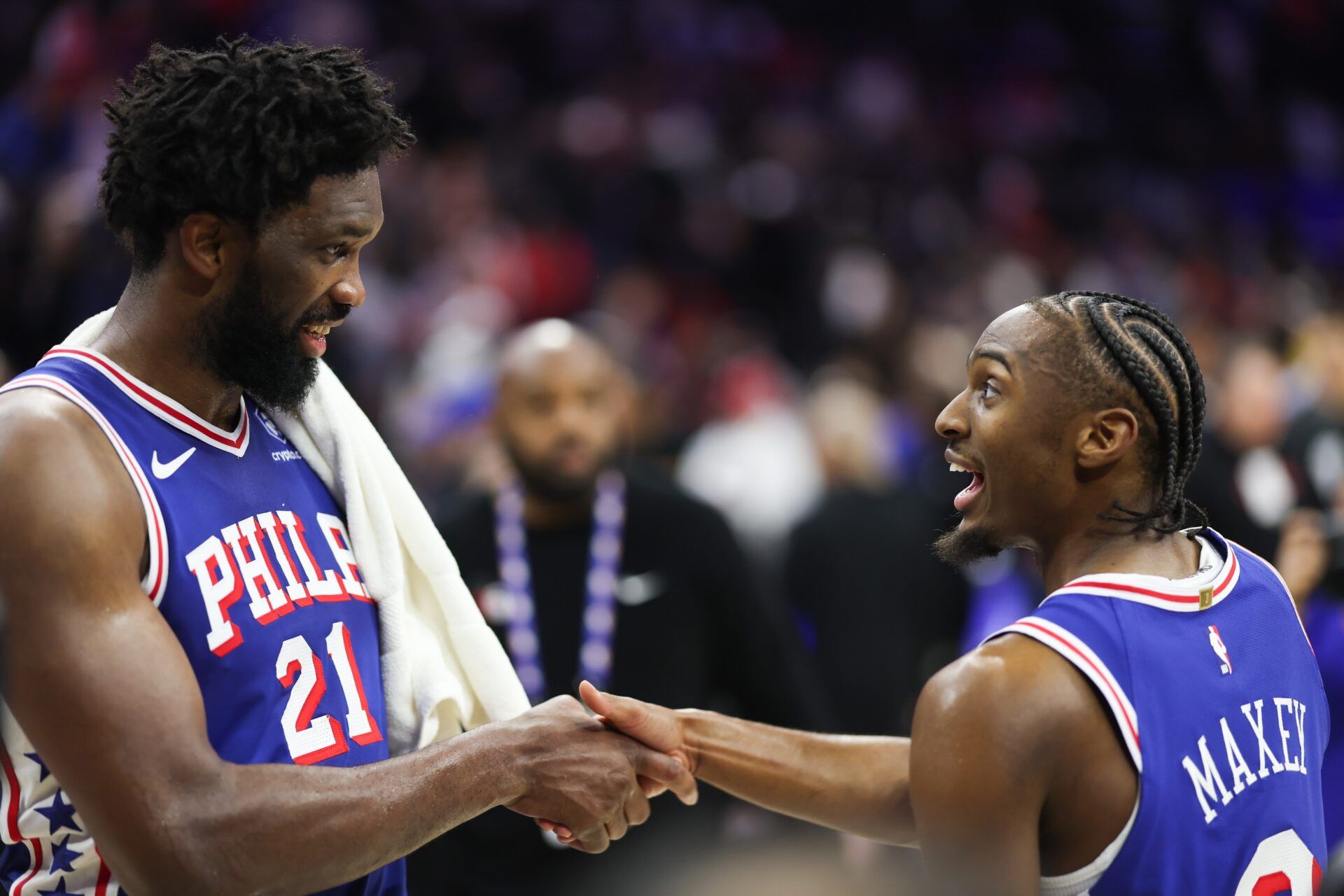 Philadelphia 76ers center Joel Embiid (21) and guard Tyrese Maxey (0) celebrate after an overtime win against the Houston Rockets at Xfinity Mobile Arena.