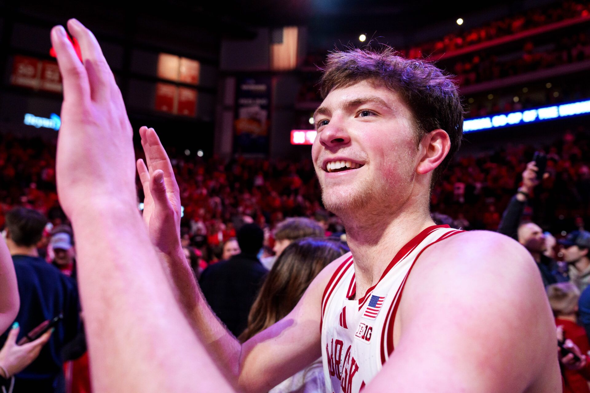 Nebraska Cornhuskers forward Pryce Sandfort (21) celebrates with fans after defeating the Michigan State Spartans at Pinnacle Bank Arena.
