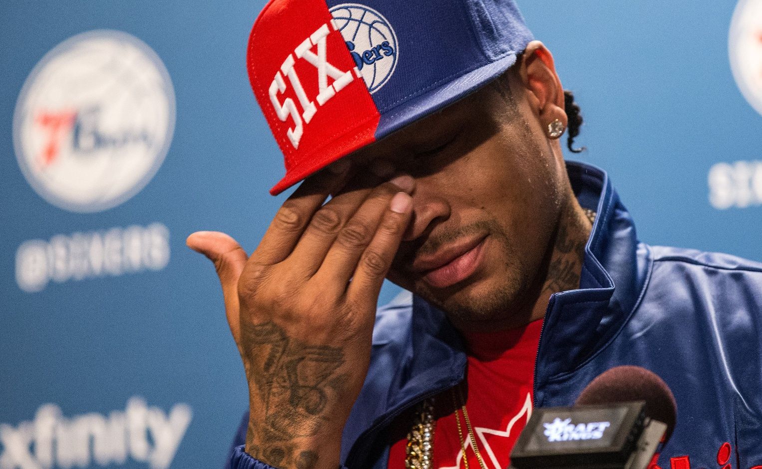 Philadelphia 76ers legend Allen Iverson wipes tears away as he talks about his selection for enshrinement in the Naismith Memorial Basketball Hall of Fame as a member of the Class of 2016 during a press conference at Wells Fargo Center.