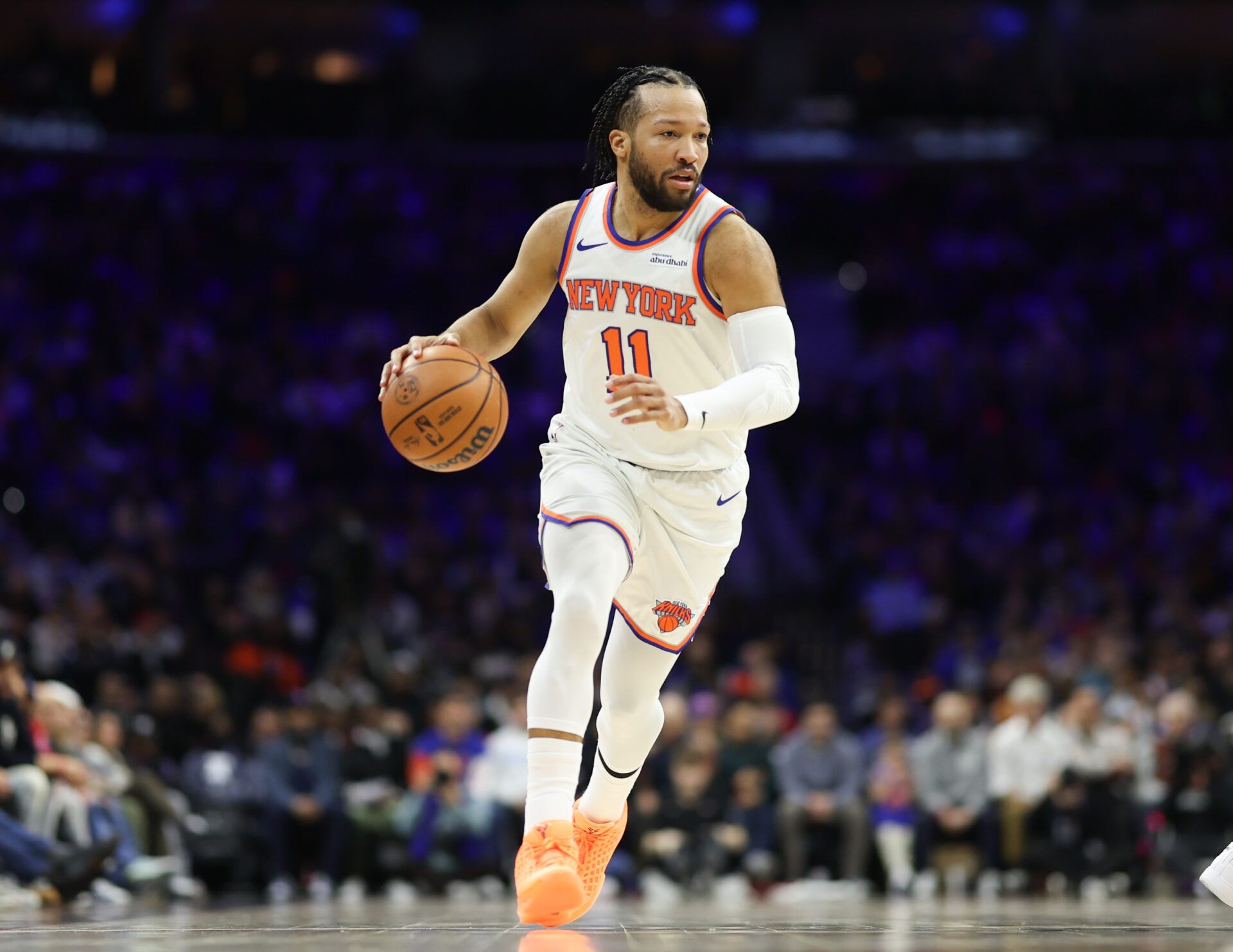 New York Knicks guard Jalen Brunson (11) dribbles the ball against the Philadelphia 76ers during the first quarter at Xfinity Mobile Arena.
