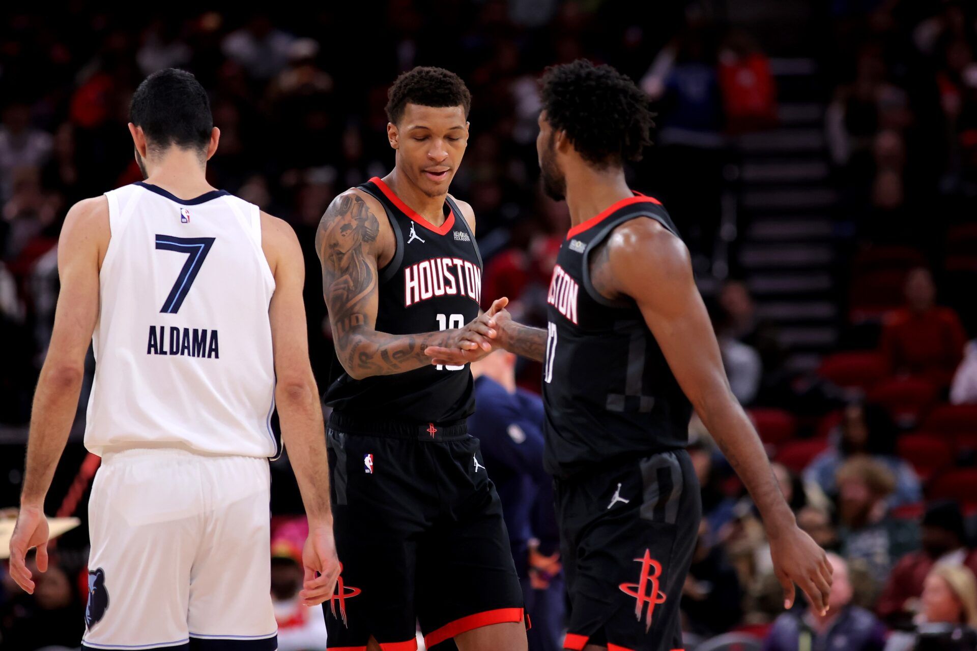 Houston Rockets forward Jabari Smith Jr. (10) congratulates Houston Rockets forward Tari Eason (17) after a made basket against the Memphis Grizzlies during the first quarter at Toyota Center.