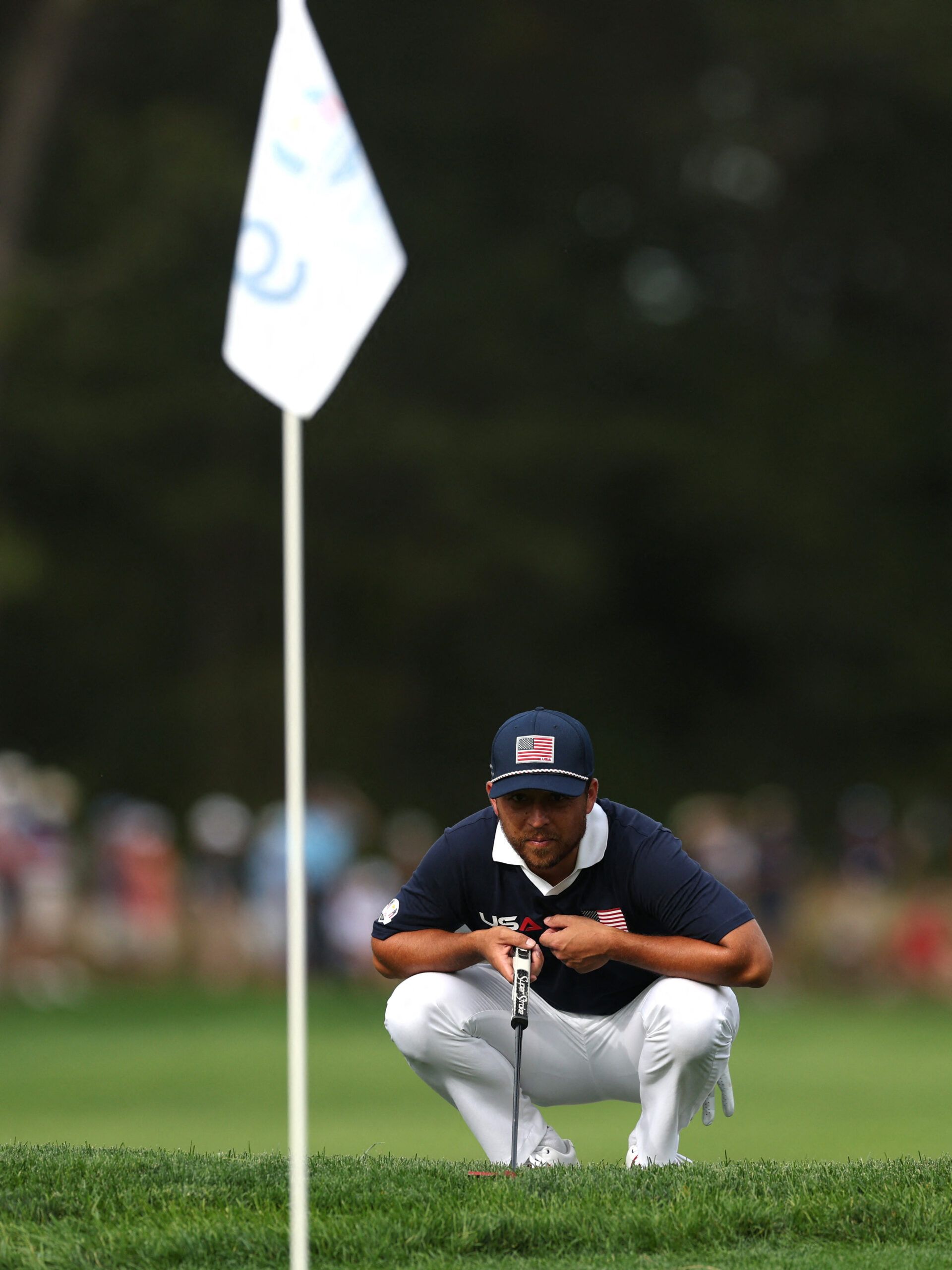 [US, Mexico & Canada customers only] Sep 27, 2025; Bethpage, New York, USA; Team USA's Xander Schauffele lines up his putt on the 9th hole during the four-balls on the second day of competition for the Ryder Cup at Bethpage Black.