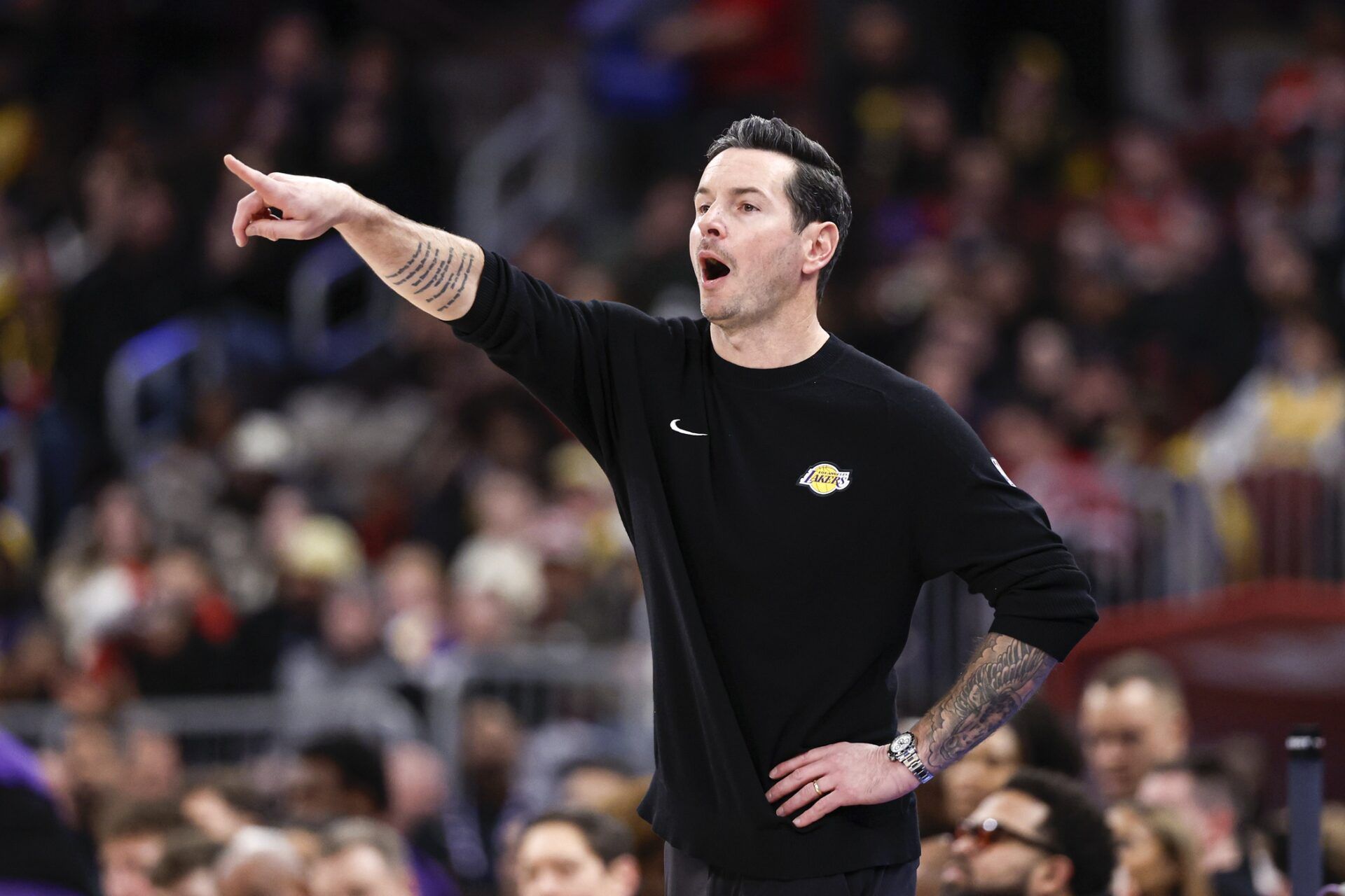 Los Angeles Lakers head coach JJ Redick directs his team against the Chicago Bulls during the first half at United Center.