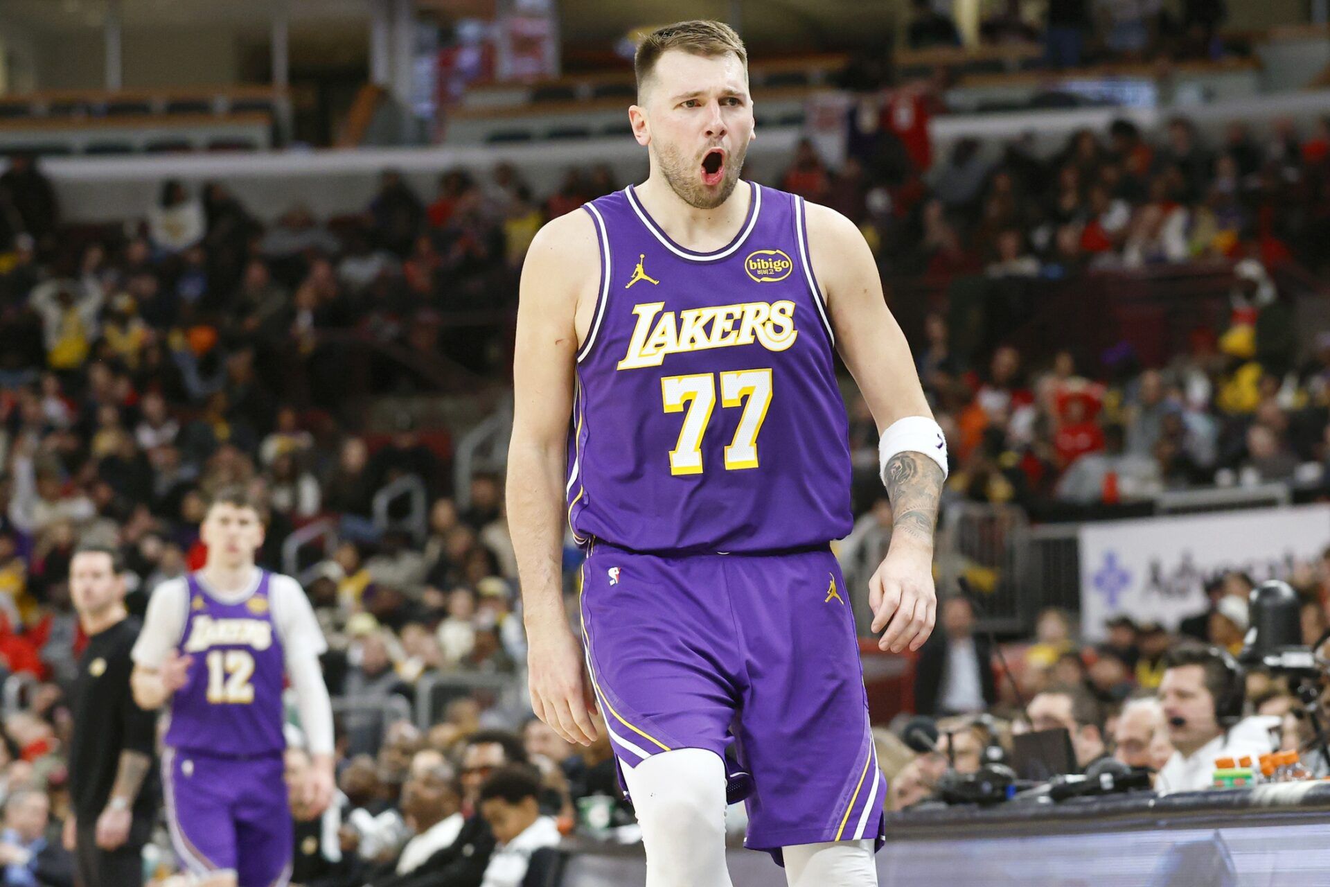 Los Angeles Lakers guard Luka Doncic (77) reacts after scoring against the Chicago Bulls during the second half at United Center.