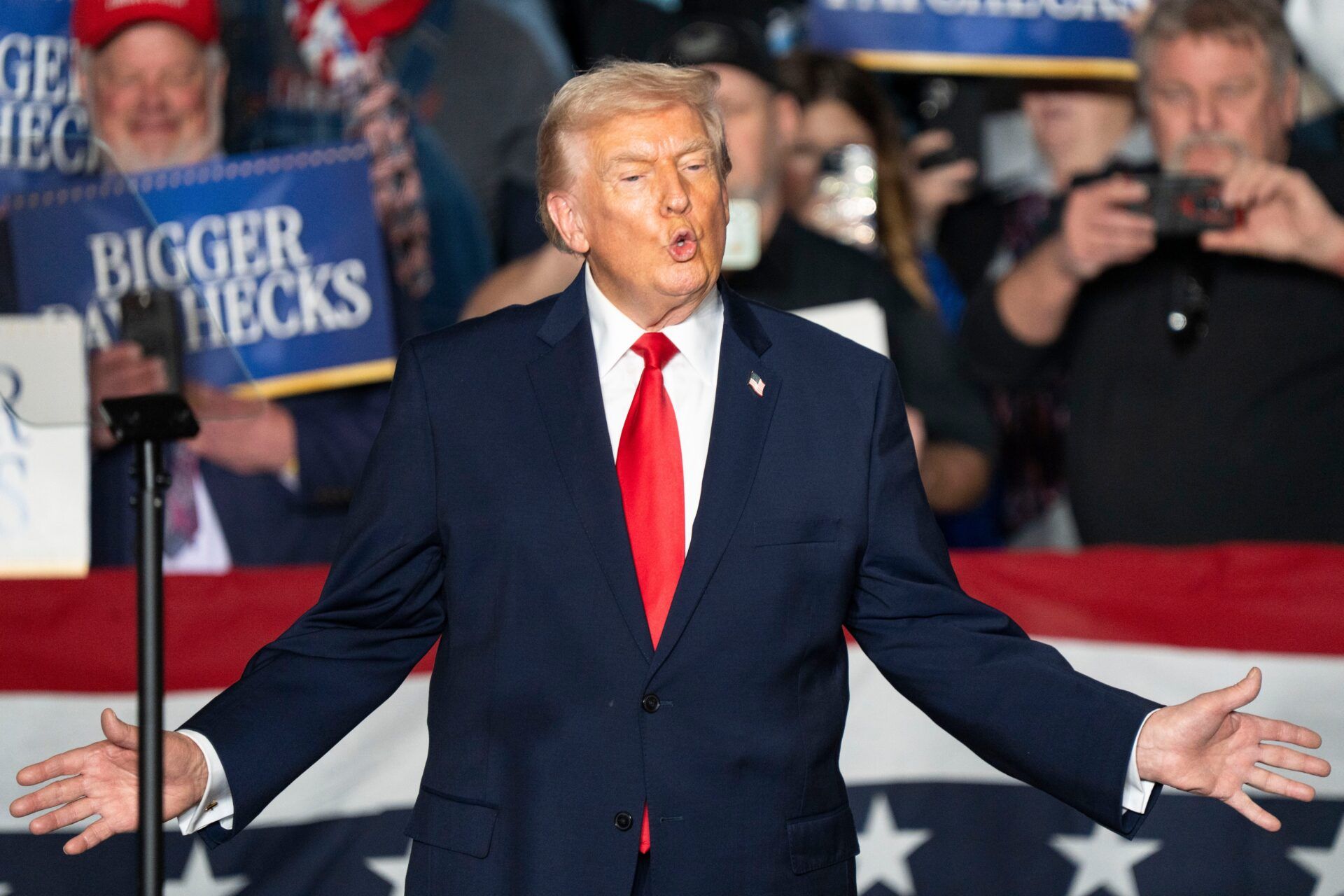 President Donald Trump takes the stage during a rally at Horizon Events Center on Tuesday, Jan. 27, 2026 in Clive.