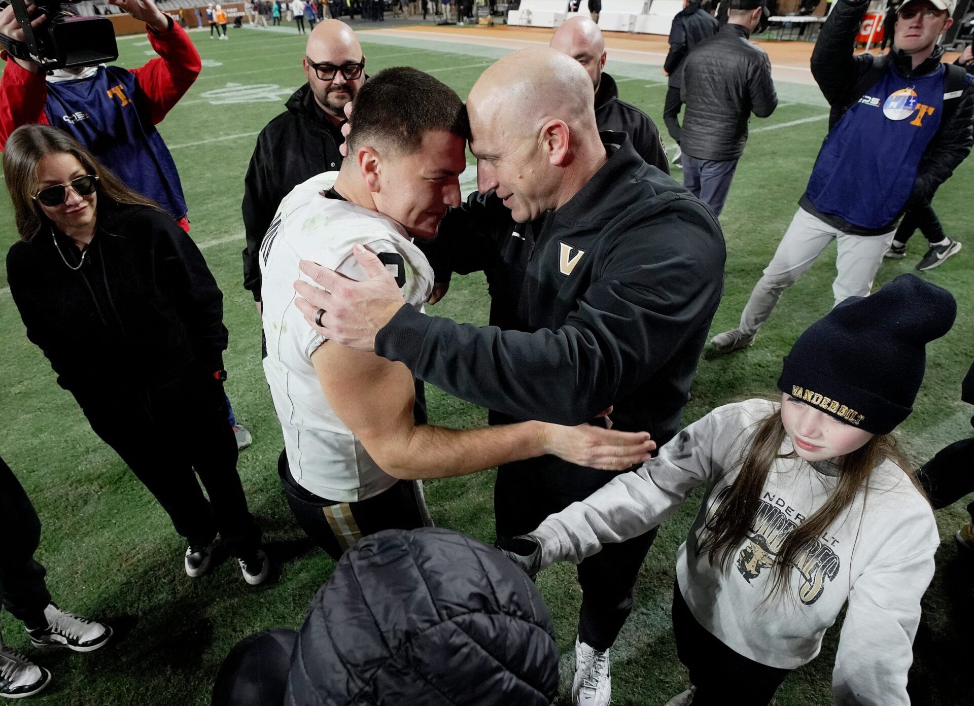 Vanderbilt quarterback Diego Pavia (2) and coach Clark Lea embrace after the team’s win against Tennessee at Neyland Stadium in Knoxville, Tenn., Saturday, Nov. 29, 2025.