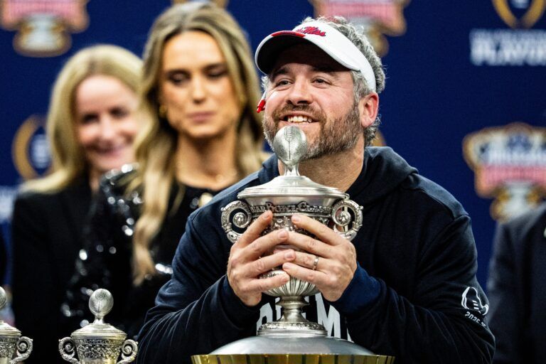 Ole Miss head coach Pete Golding lifts the Sugar Bowl trophy after the Sugar Bowl and College Football Playoff quarterfinals at Caesars Superdome in New Orleans, La., on Thursday, Jan. 1, 2026. Ole Miss defeated Georgia 39-34.