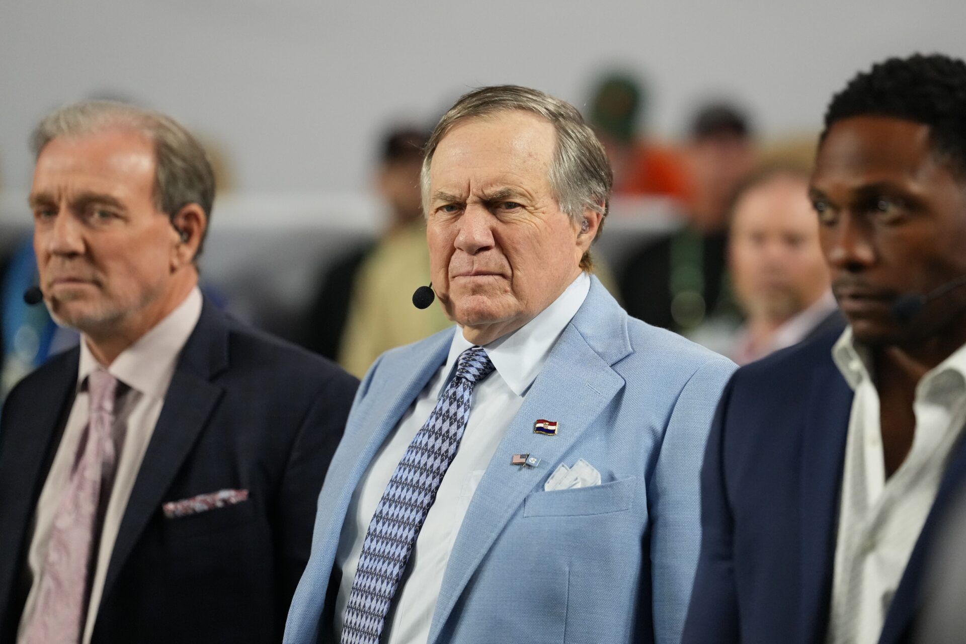 TV analyst Bill Belichick watches the Miami Hurricanes play the Indiana Hoosiers during the first half of the College Football Playoff National Championship game at Hard Rock Stadium.