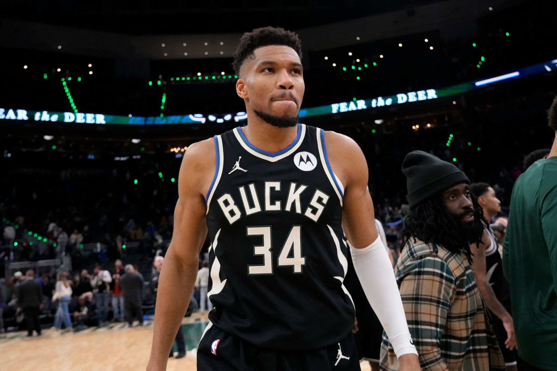 Milwaukee Bucks forward Giannis Antetokounmpo (34) walks from the court following the game against the Denver Nuggets at Fiserv Forum.