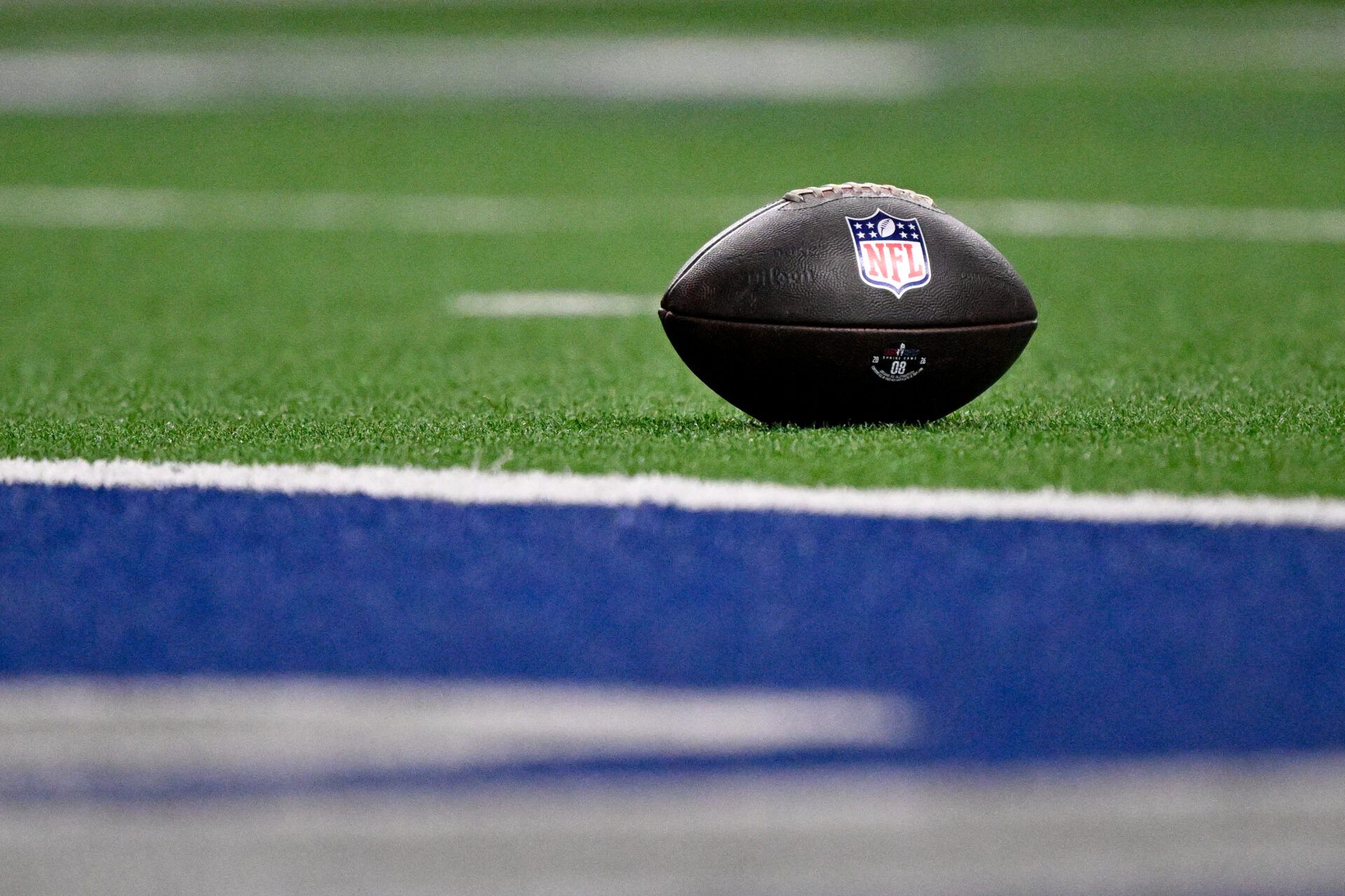 A view of the NFL logo on a football at the goal line during the second half between the East and the West at the Ford Center at the Star.