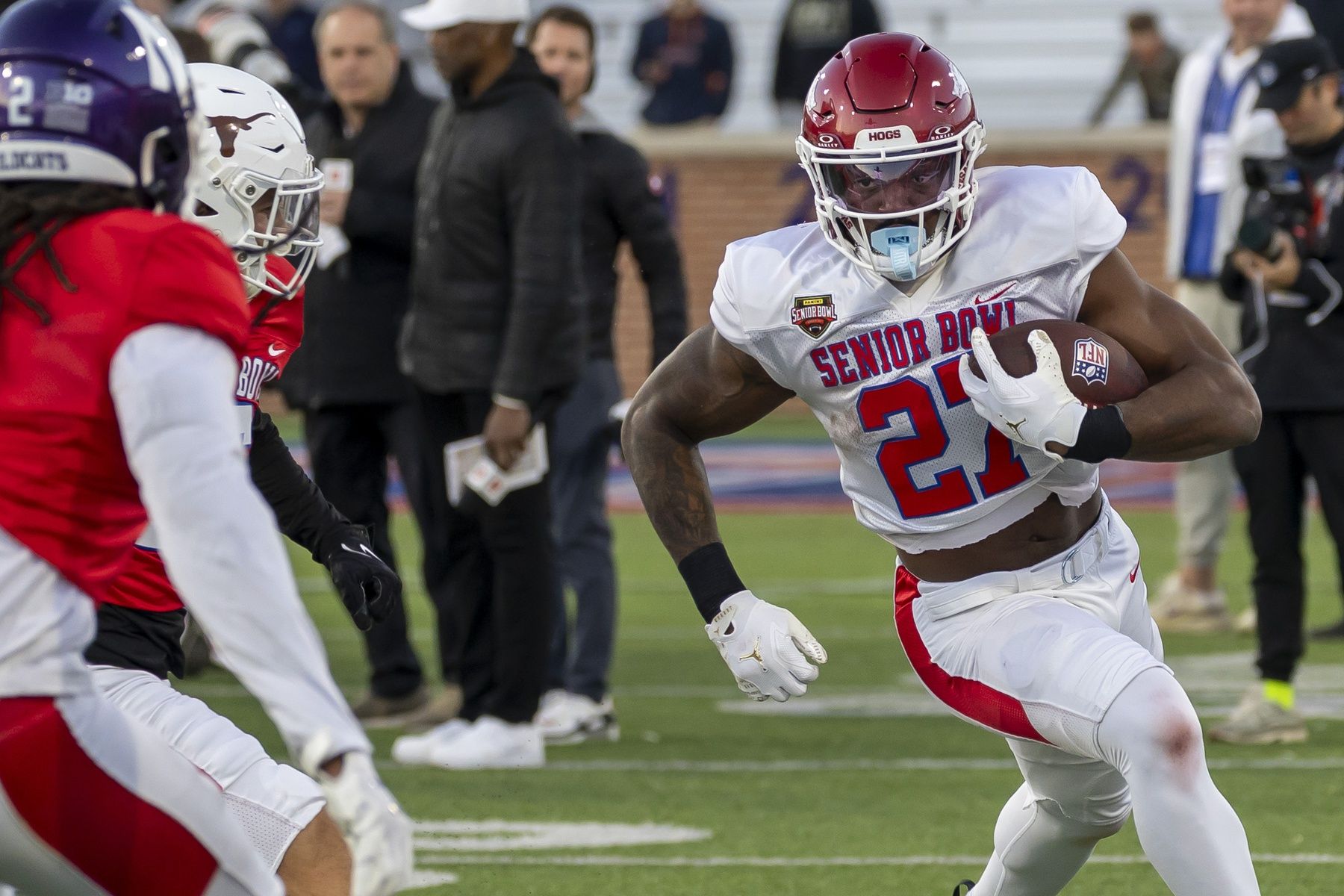 American Team running back Mike Washington Jr. (27) of Arkansas runs the ball during American Senior Bowl practice at Hancock Whitney Stadium.
