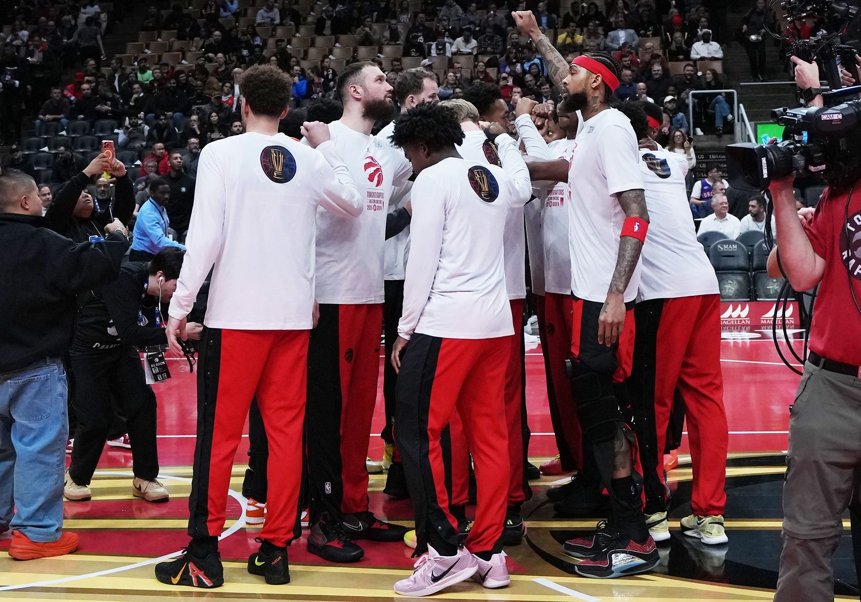 The Toronto Raptors players huddle before the start of a game against the Indiana Pacers at Scotiabank Arena.