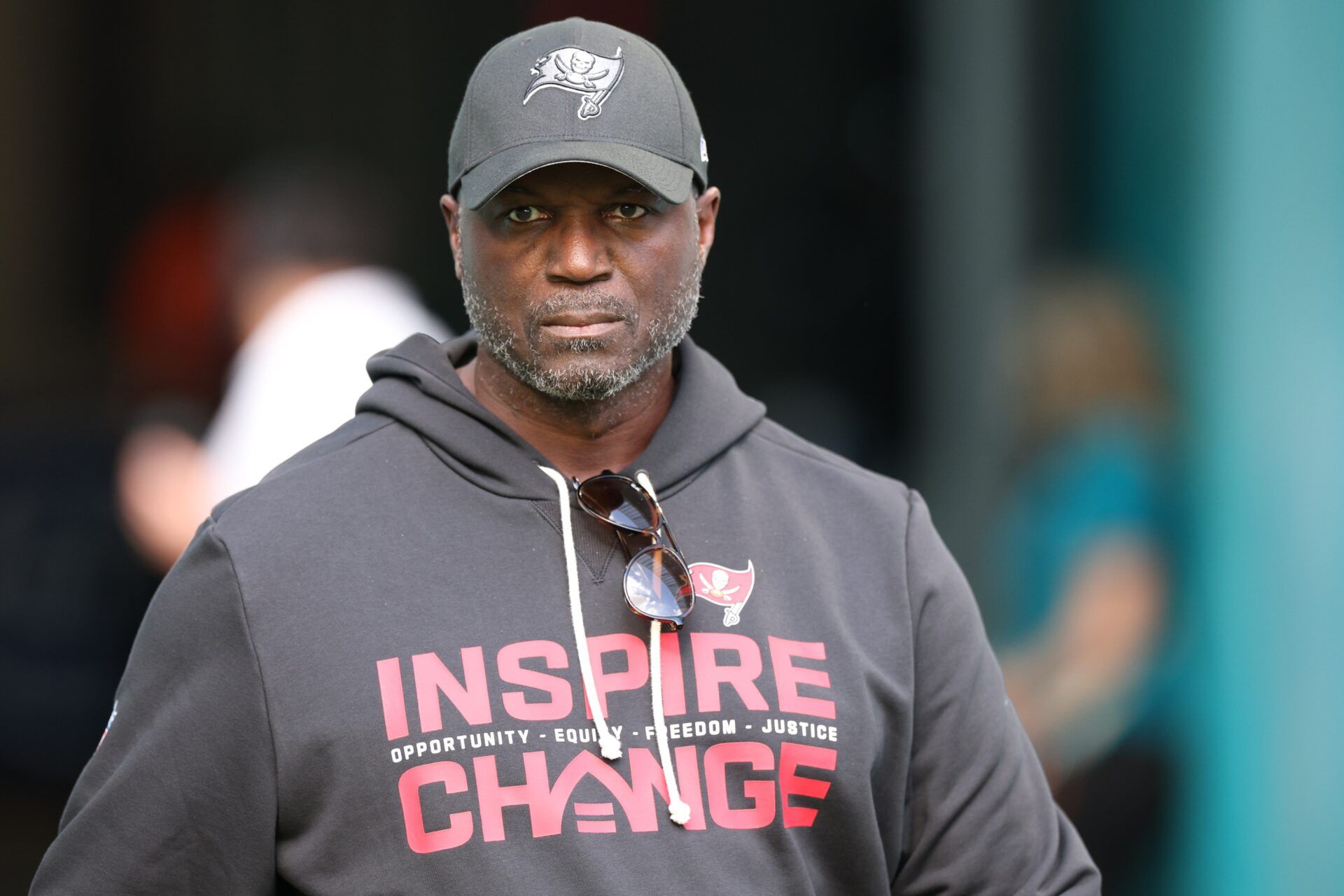 Tampa Bay Buccaneers head coach Todd Bowles walks around the field during warmups prior to a game against the Miami Dolphins at Hard Rock Stadium.