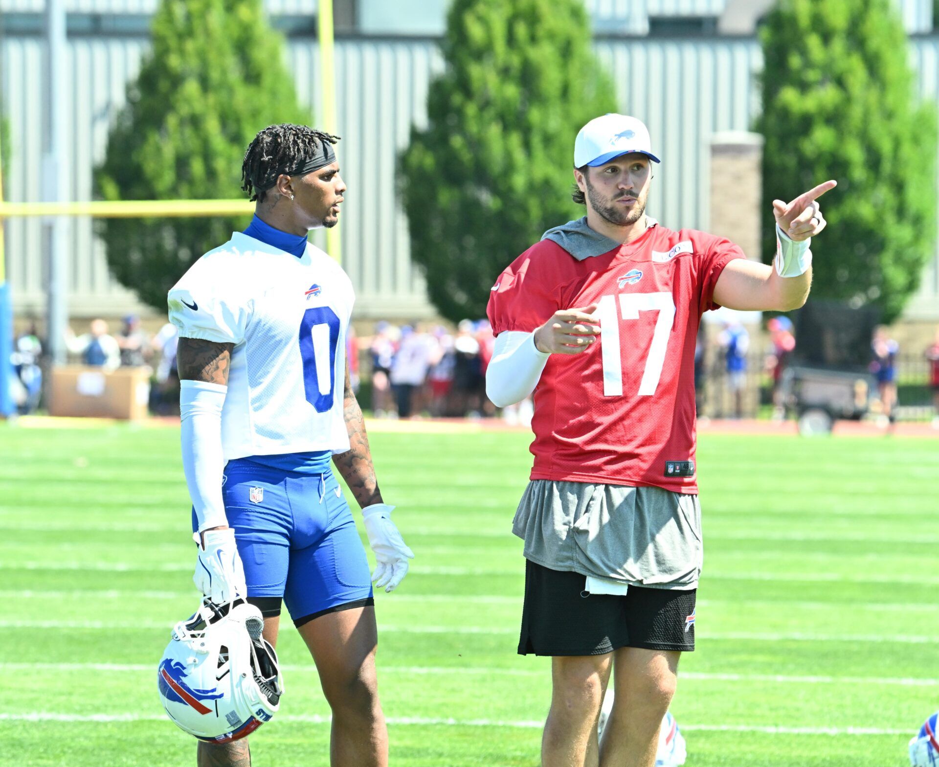 Buffalo Bills quarterback Josh Allen (17) talks with wide receiver Keon Coleman (0) during training camp at St. John Fisher University.