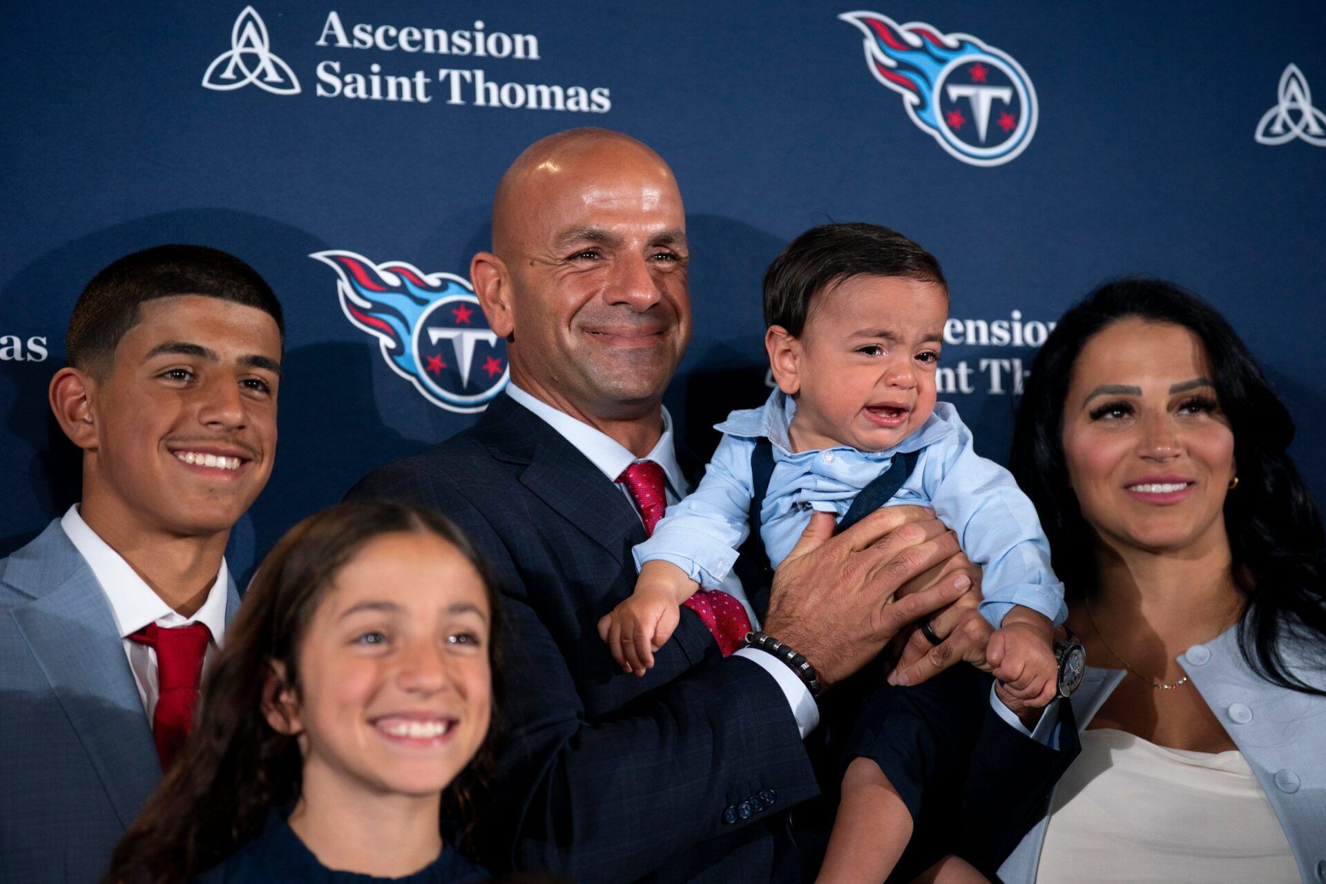 Tennessee Titans new head coach Robert Saleh, center, poses with his family, including wife, Sanaa Saleh, and youngest child, Robert Jr., after the new head coach’s introductory press conference at Ascension Saint Thomas Sports Park in Nashville, Tenn., Thursday, Jan. 29, 2026.