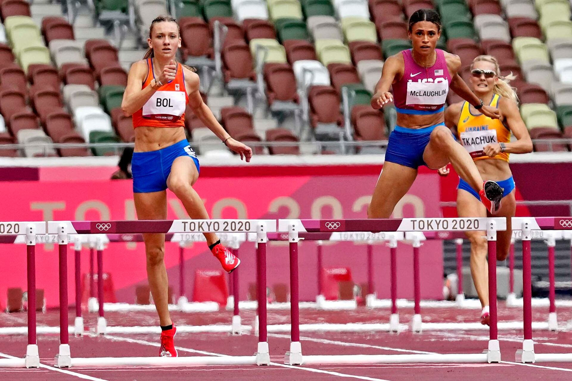 Femke Bol (NED) and Sydney McLaughlin (USA) in the women's 400m hurdles final during the Tokyo 2020 Olympic Summer Games at Olympic Stadium.