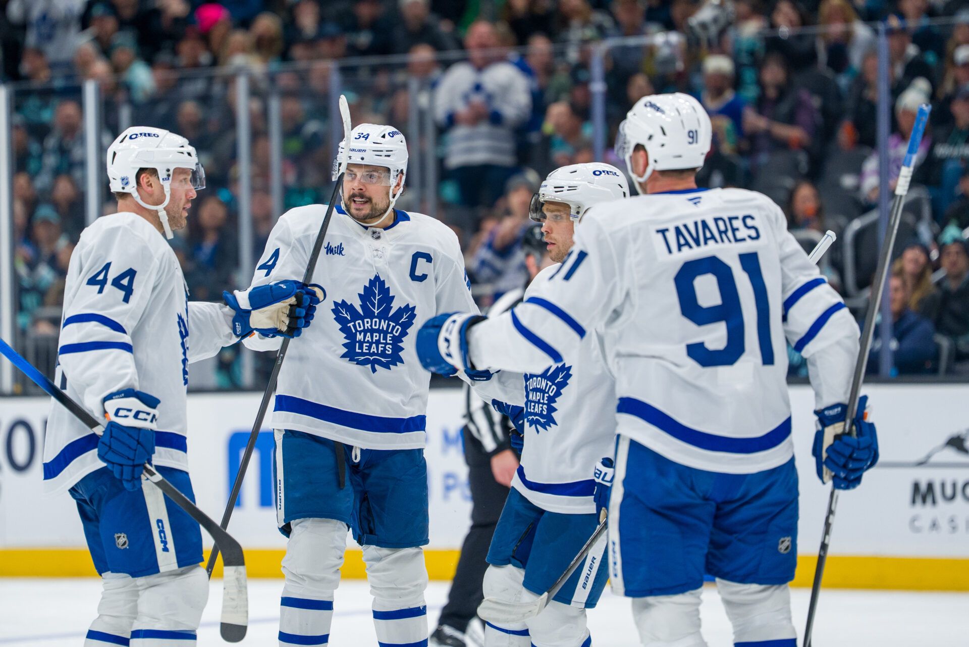 Toronto Maple Leafs, from left, defenseman Morgan Rielly (44), forward Auston Matthews (34), forward Max Domi (11) and forward John Tavares (91) celebrate a goal during the third period at Climate Pledge Arena.