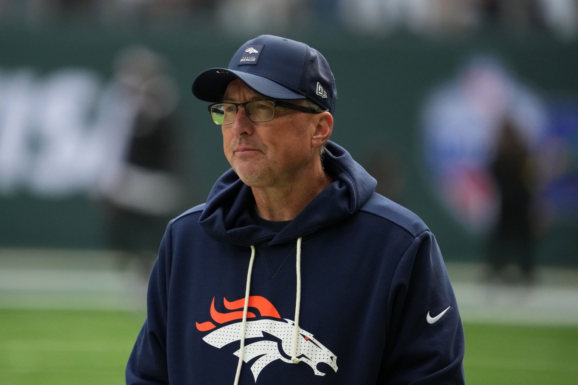 Denver Broncos senior offensive assistant coach Pete Carmichael watches during an NFL International Series game against the New York Jets at Tottenham Hotspur Stadium.