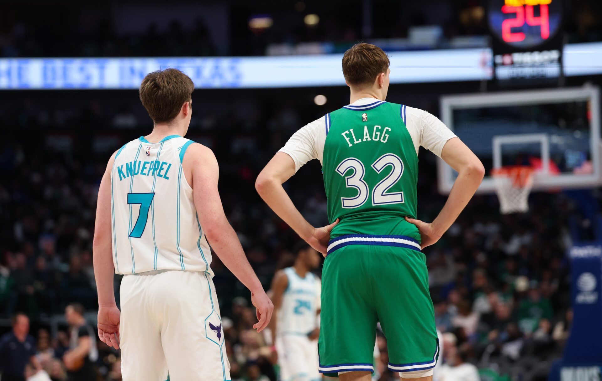 Charlotte Hornets guard Kon Knueppel (7) stands with Dallas Mavericks forward Cooper Flagg (32) during the second half at American Airlines Center.