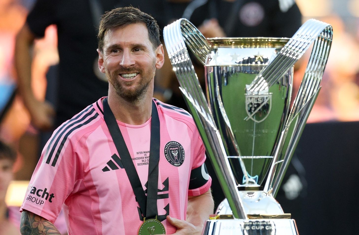 Inter Miami forward Lionel Messi (10) looks on with the Philip F. Anschutz trophy after winning the 2025 MLS Cup against the Vancouver Whitecaps FC at Chase Stadium.
