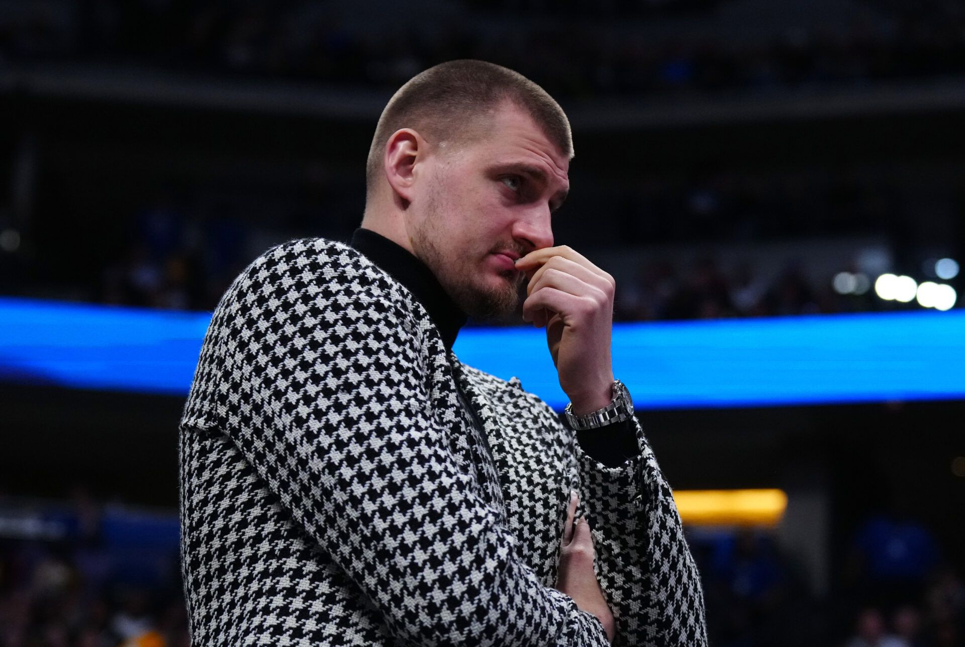 Denver Nuggets center Nikola Jokic (15) watches game play in the fourth quarter against the Brooklyn Nets at Ball Arena.