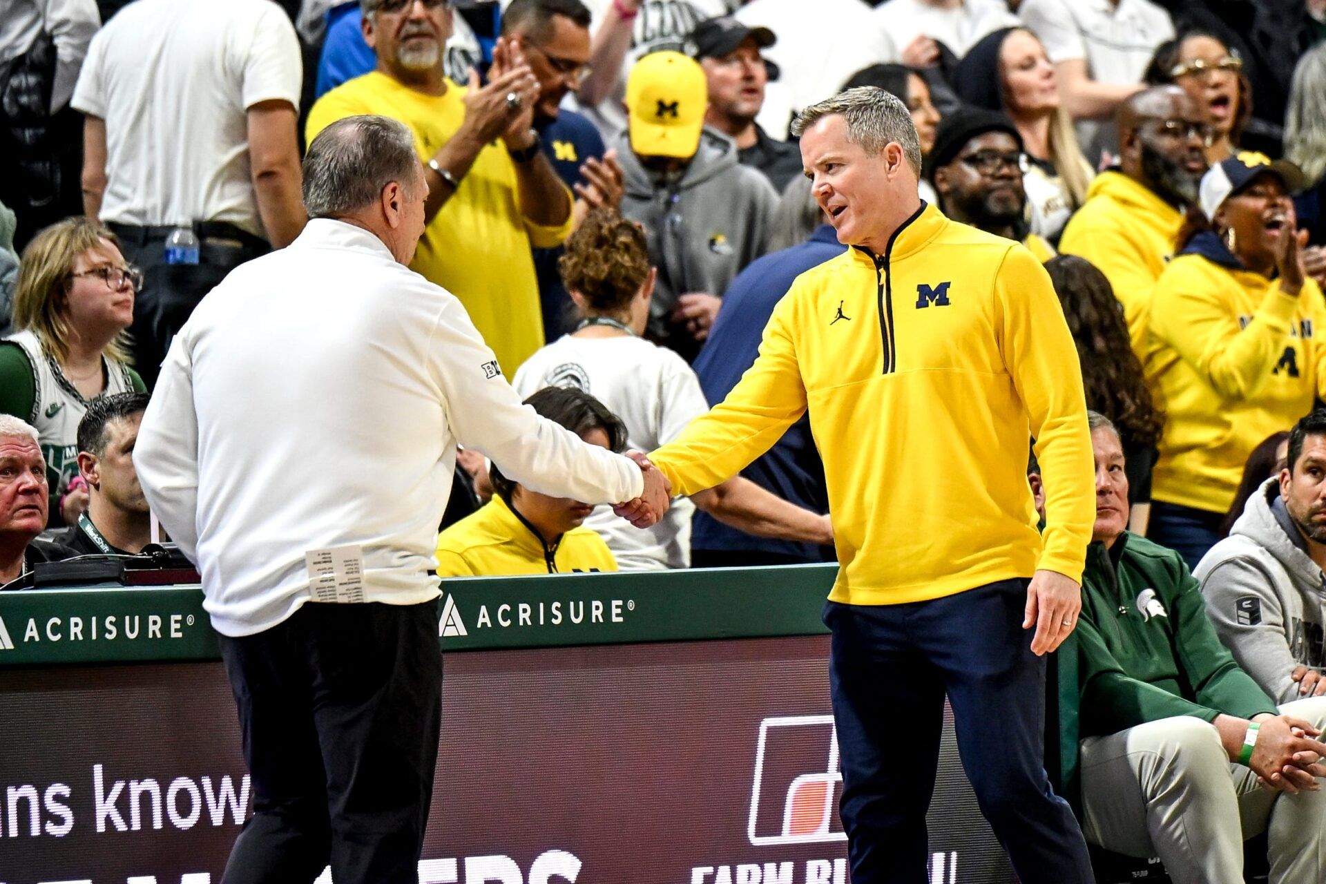 Michigan State's head coach Tom Izzo, left, shakes hands with Michigan's head coach Dusty May after the game on Friday, Jan. 30, 2026, at the Breslin Center in East Lansing.