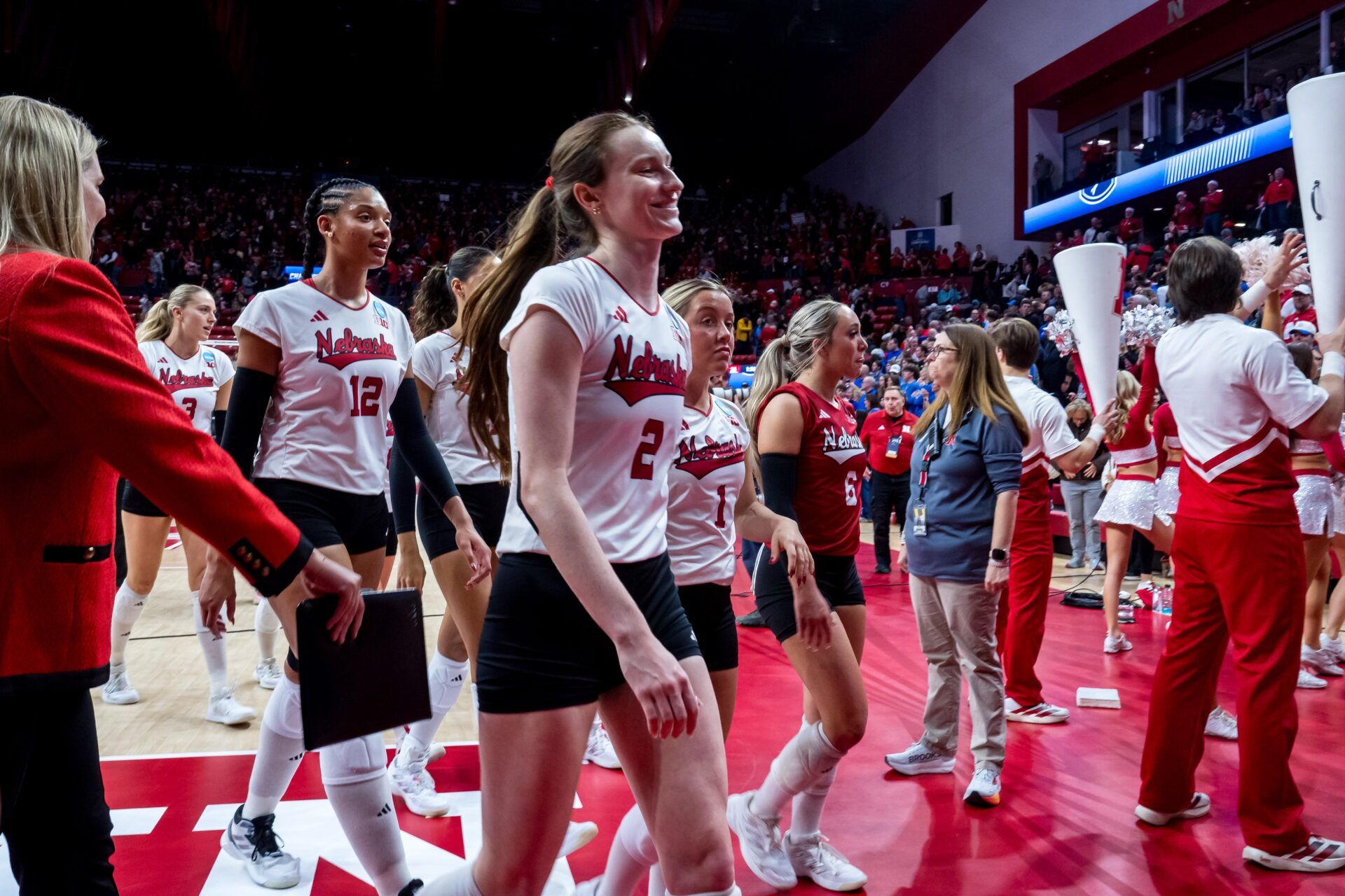 Nebraska Cornhuskers setter Bergen Reilly (2), outside hitter Taylor Landfair (12), libero Keri Leimbach (1) and libero Laney Choboy (6) walk off the court after defeating the Kansas Jayhawks at Bob Devaney Sports Center.