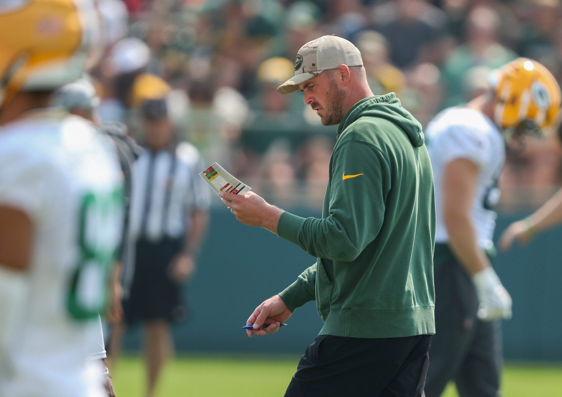 Green Bay Packers quarterbacks coach Sean Mannion reviews his practice schedule during practice on Friday, August 1, 2025, at Ray Nitschke Field in Ashwaubenon, Wis. 
Tork Mason/USA TODAY NETWORK-Wisconsin