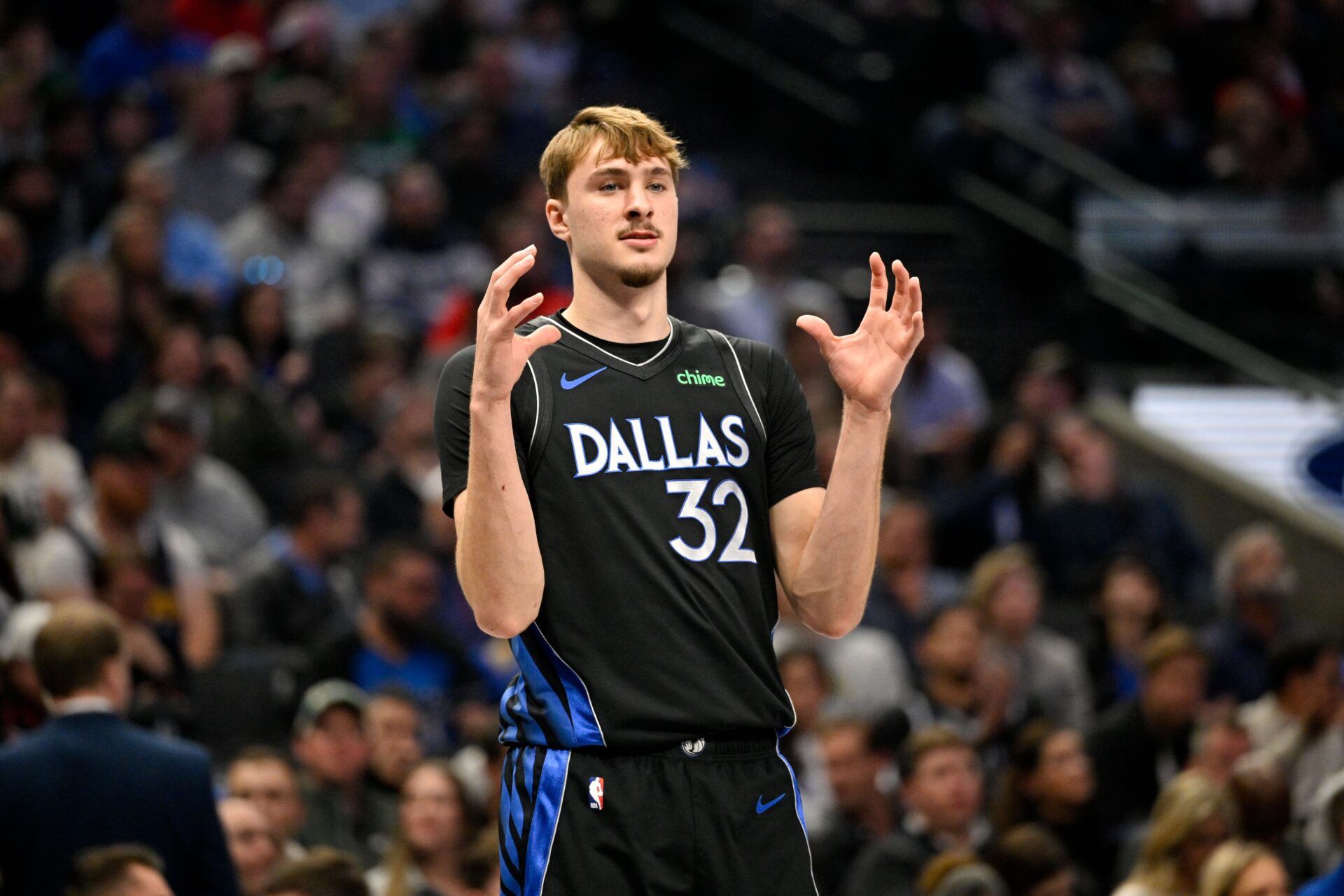 Dallas Mavericks forward Cooper Flagg (32) motions to his teammates during the first quarter against the Denver Nuggets at the American Airlines Center.