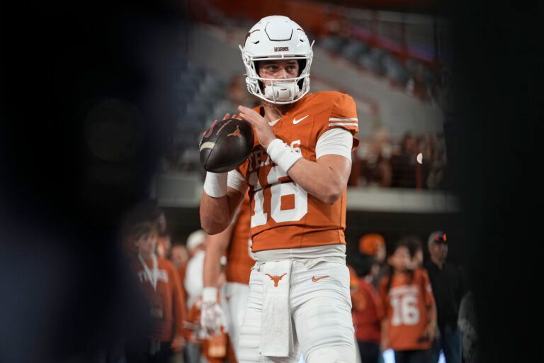 Texas Longhorns quarterback Arch Manning warms up before a game against the Texas A&M Aggies at Darrell K Royal-Texas Memorial Stadium.