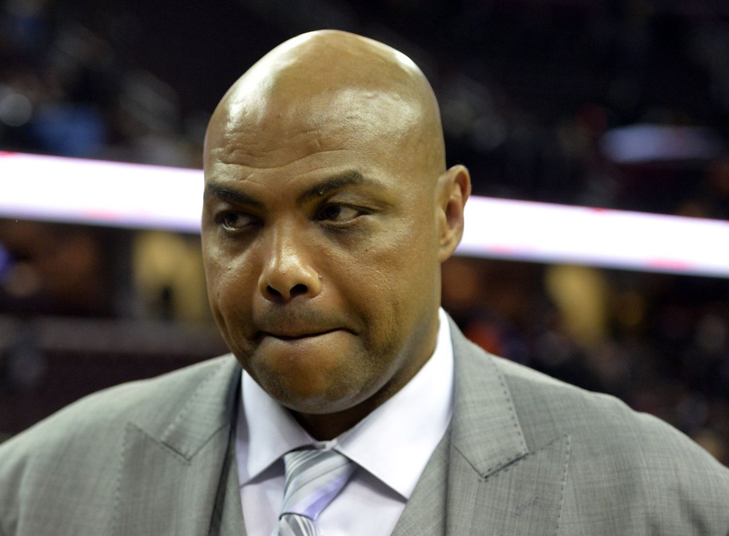 Former NBA player and current television personality Charles Barkley walks off the court after watching the New York Knicks defeat the Cleveland Cavaliers 95-90 at Quicken Loans Arena.