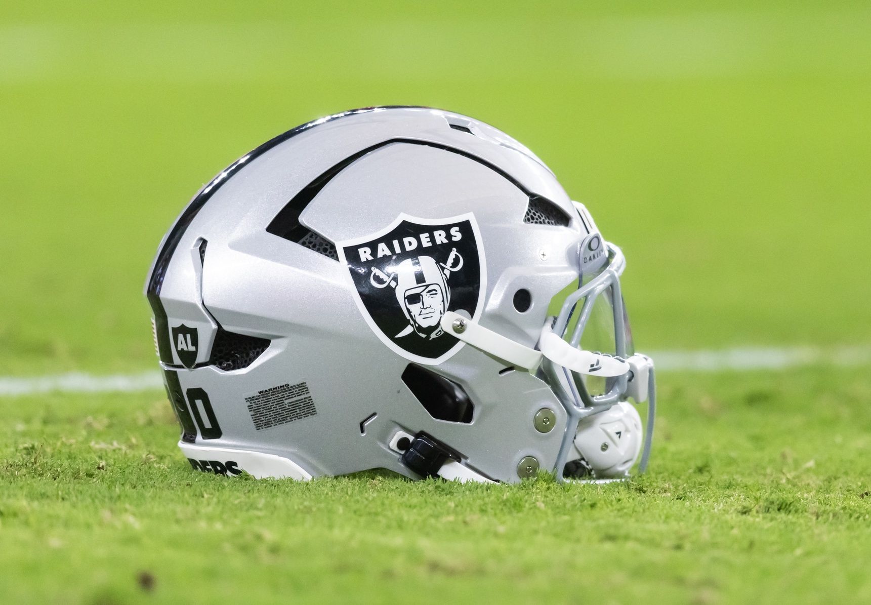Detailed view of a Las Vegas Raiders helmet during a preseason NFL game at State Farm Stadium.