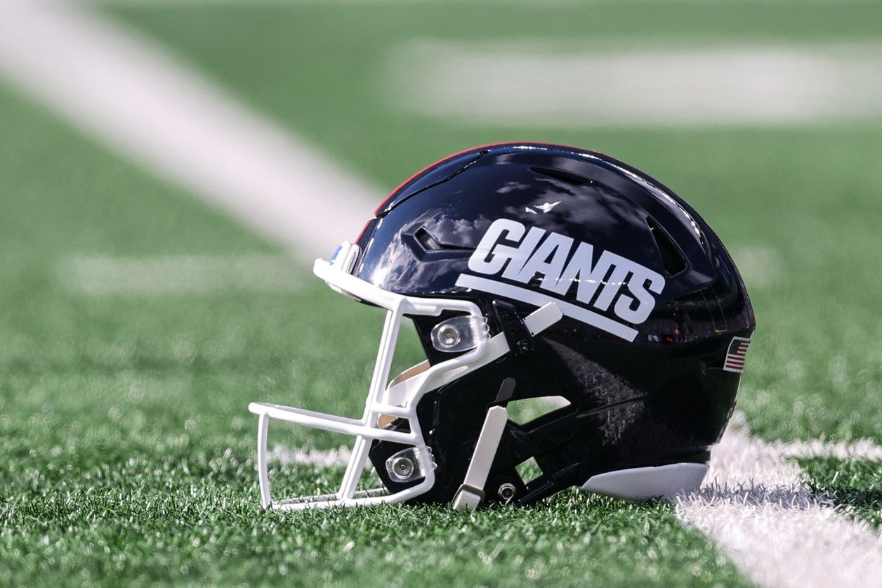 A New York Giants helmet rests on the field before the game between the Giants and the Green Bay Packers at MetLife Stadium.